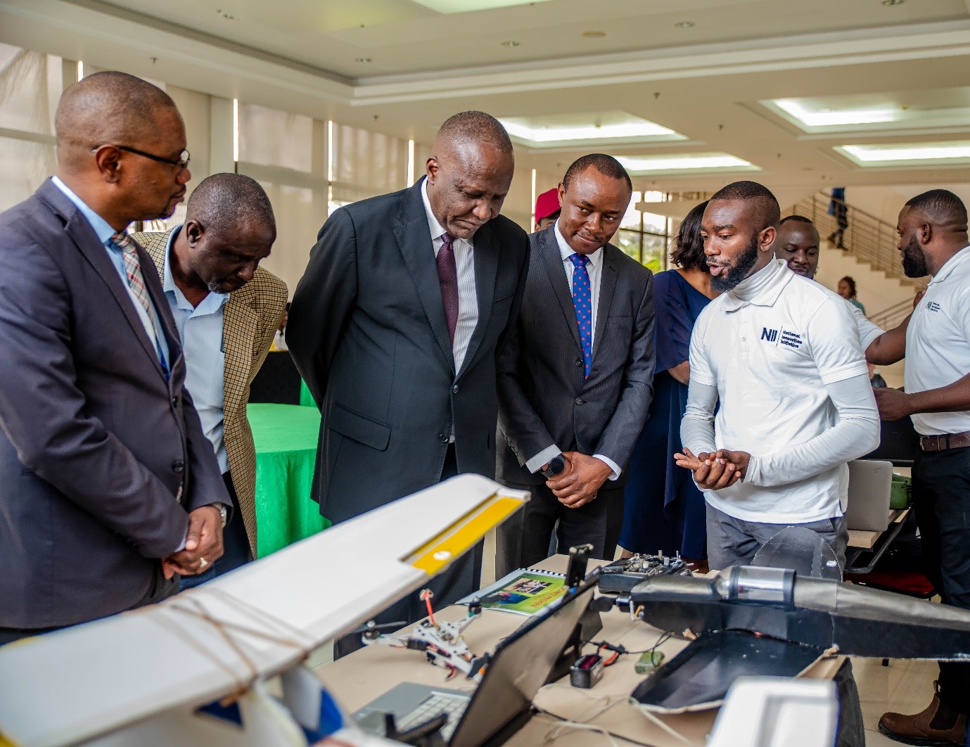 An image of Honourable Minister of Technology and Science, Felix Mutati (centre) flanked by other dignitaries, on his immediate left is the UNDP Assistant Resident Representative, Gregory Saili during the tour of Innovation Stands at the 2022 Innovation Award Ceremony, held at Government Complex.