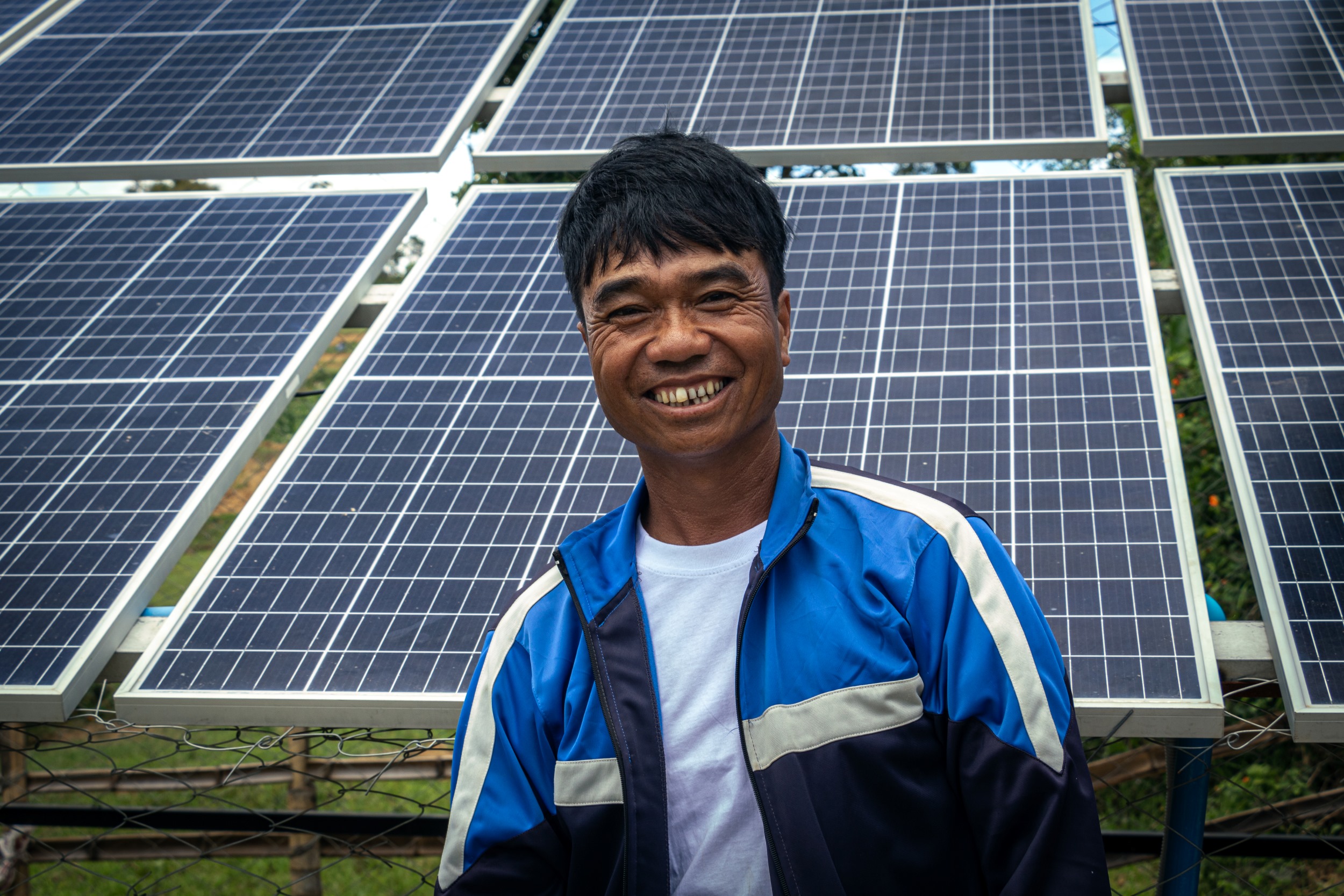U Bhone stands in front of the solar-powered water pump in his village in Shan State