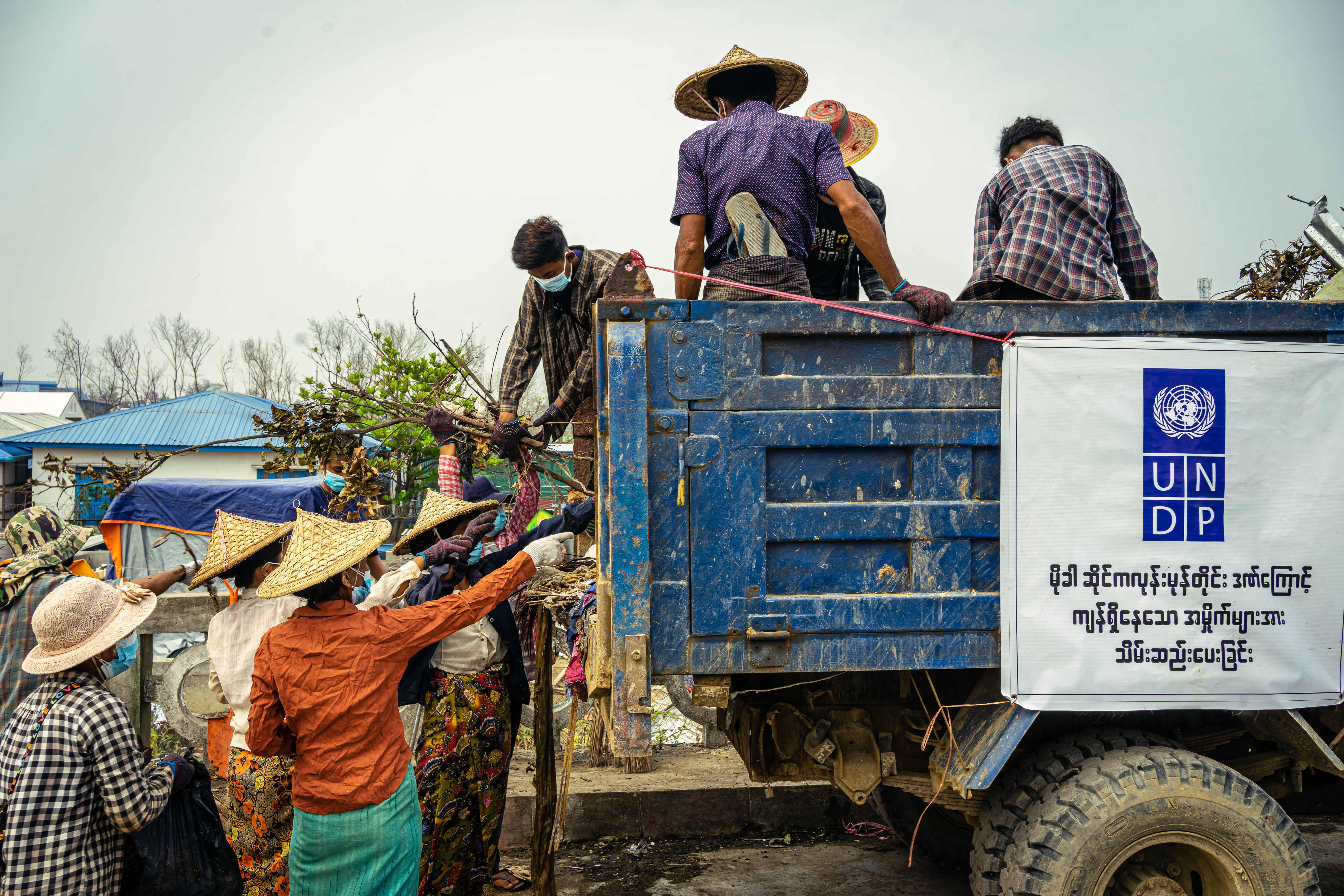  Workers from Sittwe’s IDP camps clear debris, a cash-for-work activity that provides temporary income providing a critical hand-up during emergencies