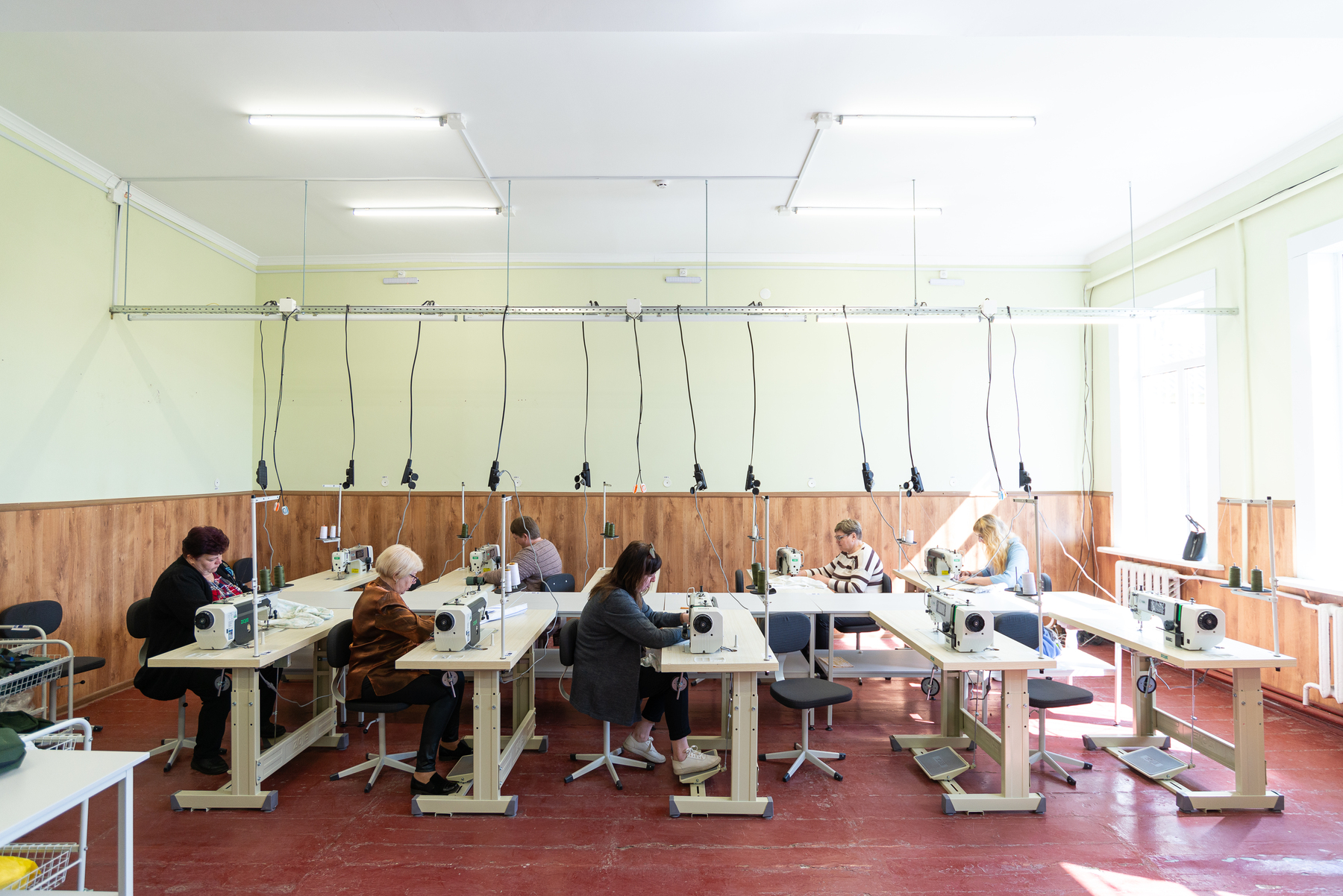 Women working in a newly opened clothing workshop in the city of Nizhyn