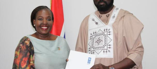 Ms. Mandisa presenting her credential to the Minister 