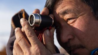 Man with binoculars