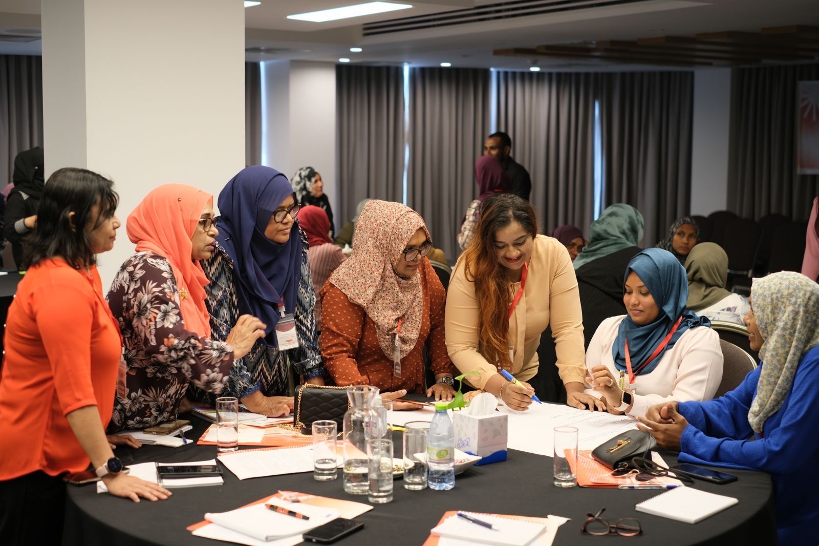 Practice Parliament for Women participants around a table