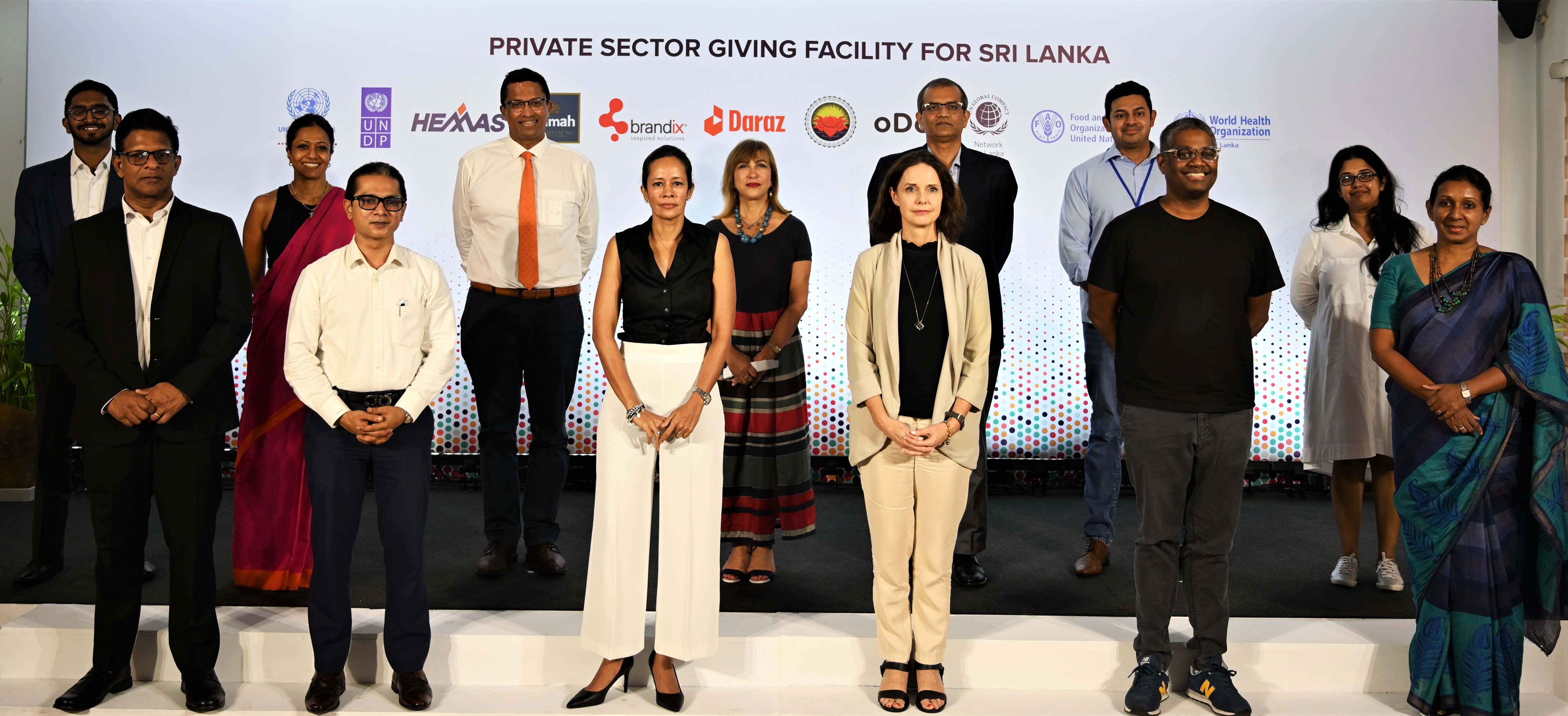 Partners of the Private Sector Giving Facility standing together