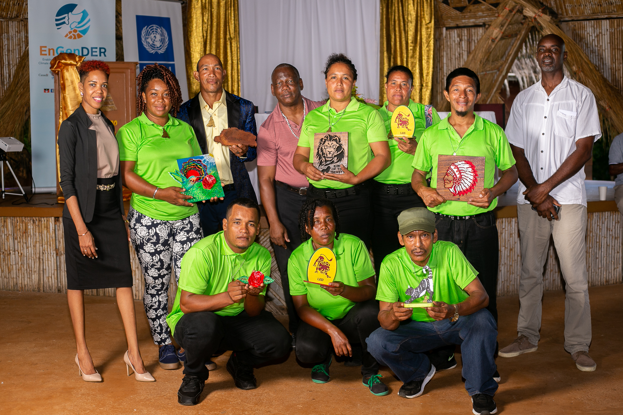 Graduates of the wood crafting training course in green, along with: back row, left: Ms. Alice Dalrymple, National Project Assistant, EnGenDER, Dominica; 3rd from left Pastor Richard Olive; 4th from left, Major. Francis Richards, Training Instructor; 6th from left, Mr. Albert Casimir, Training Instructor