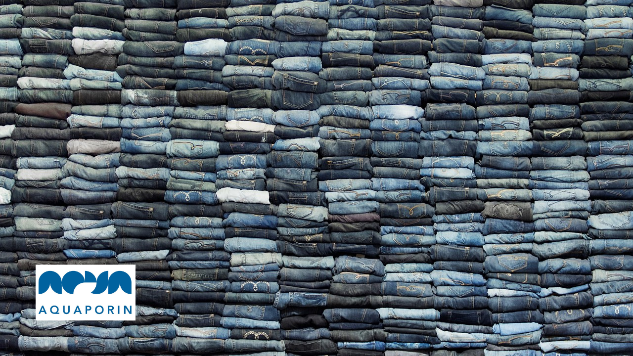 jeans stacked in pile and aquaporin logo
