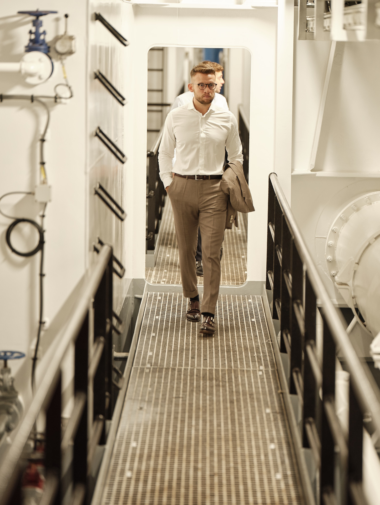 Man walking below deck in a ship