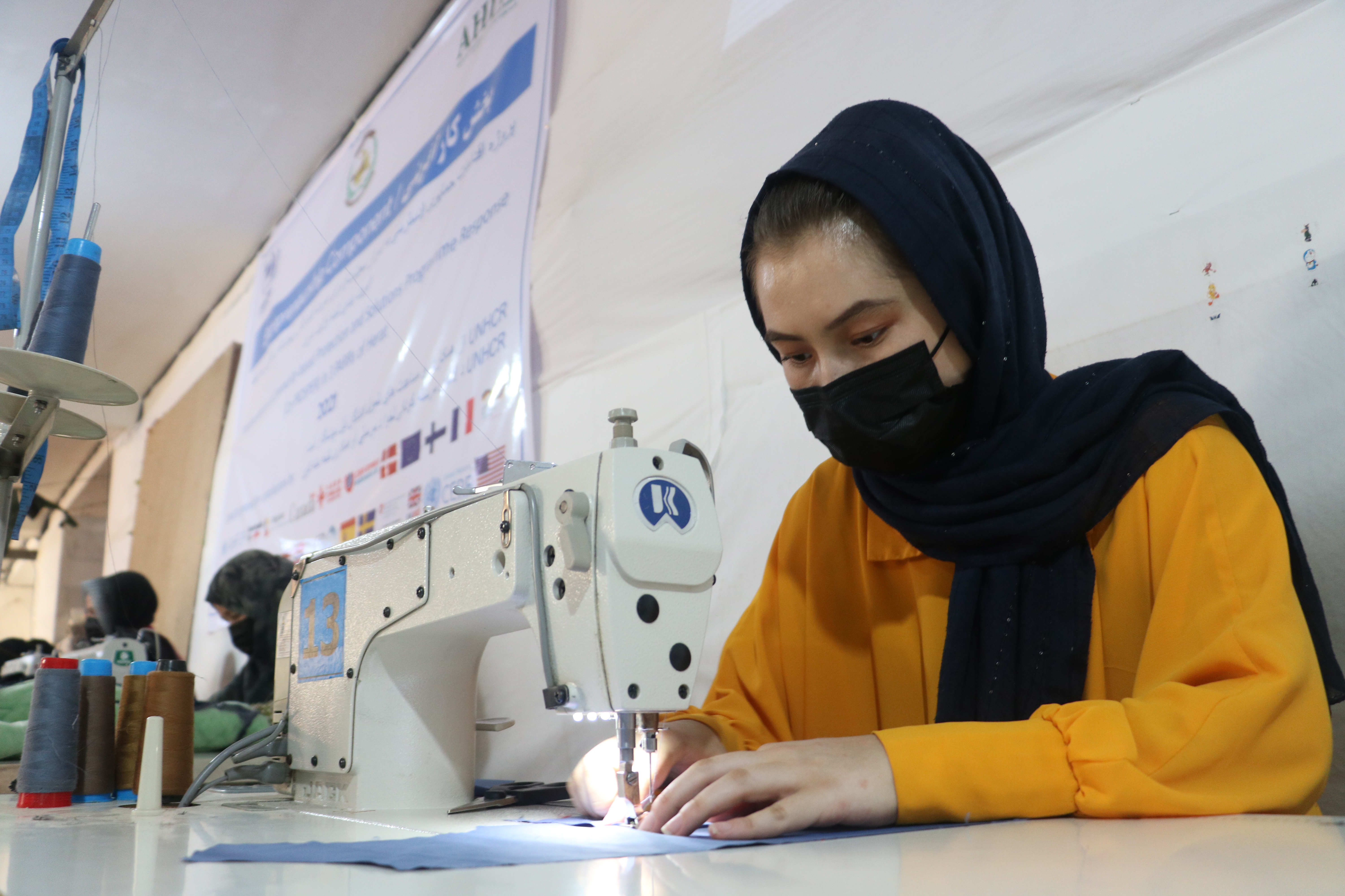  A worker in Bassgull and Ali Reza's garment factory, which employs 120 people in Herat, Afghanistan