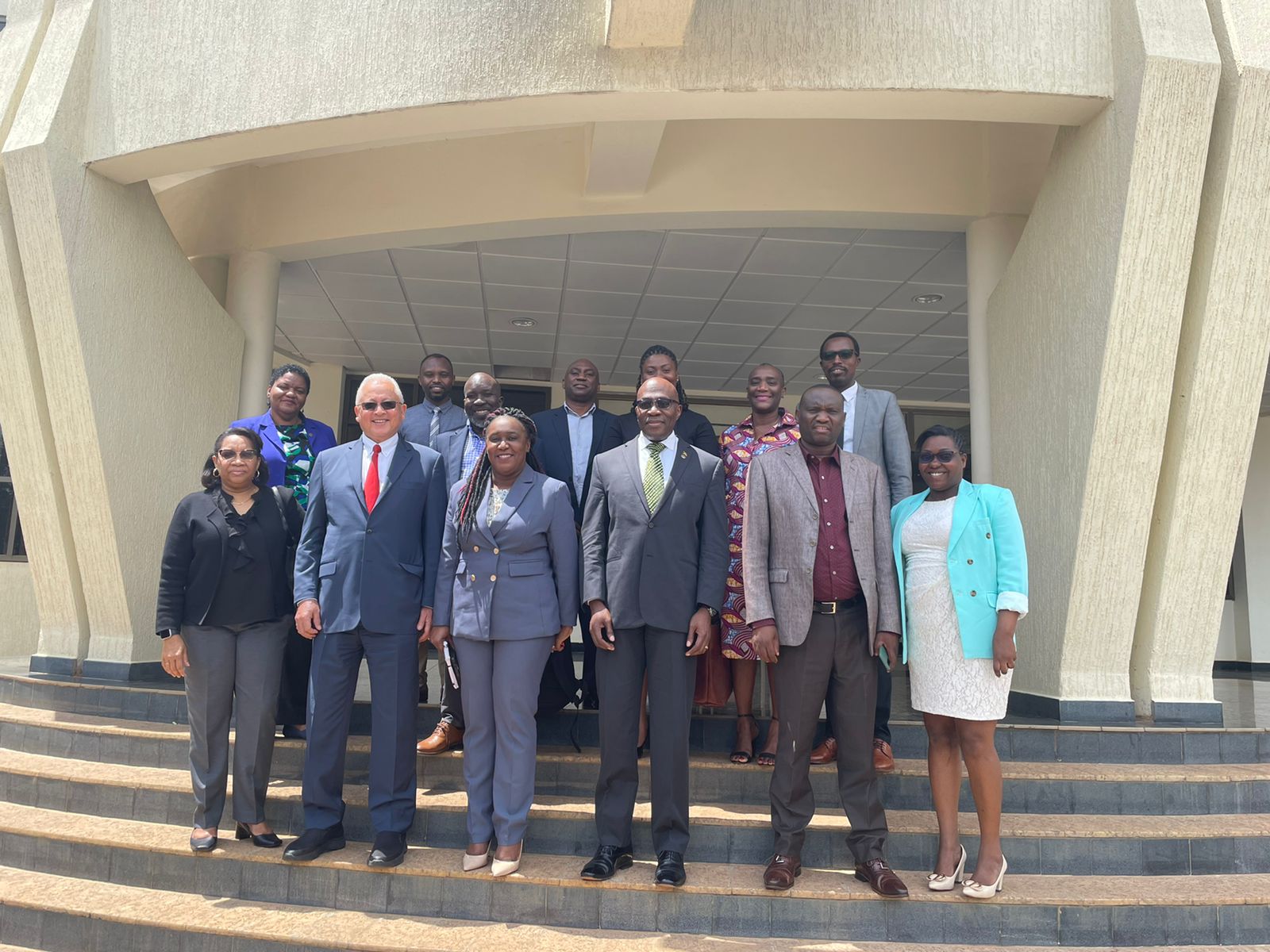 Jamaican delegation in Rwanda on steps of Rwanda High Court