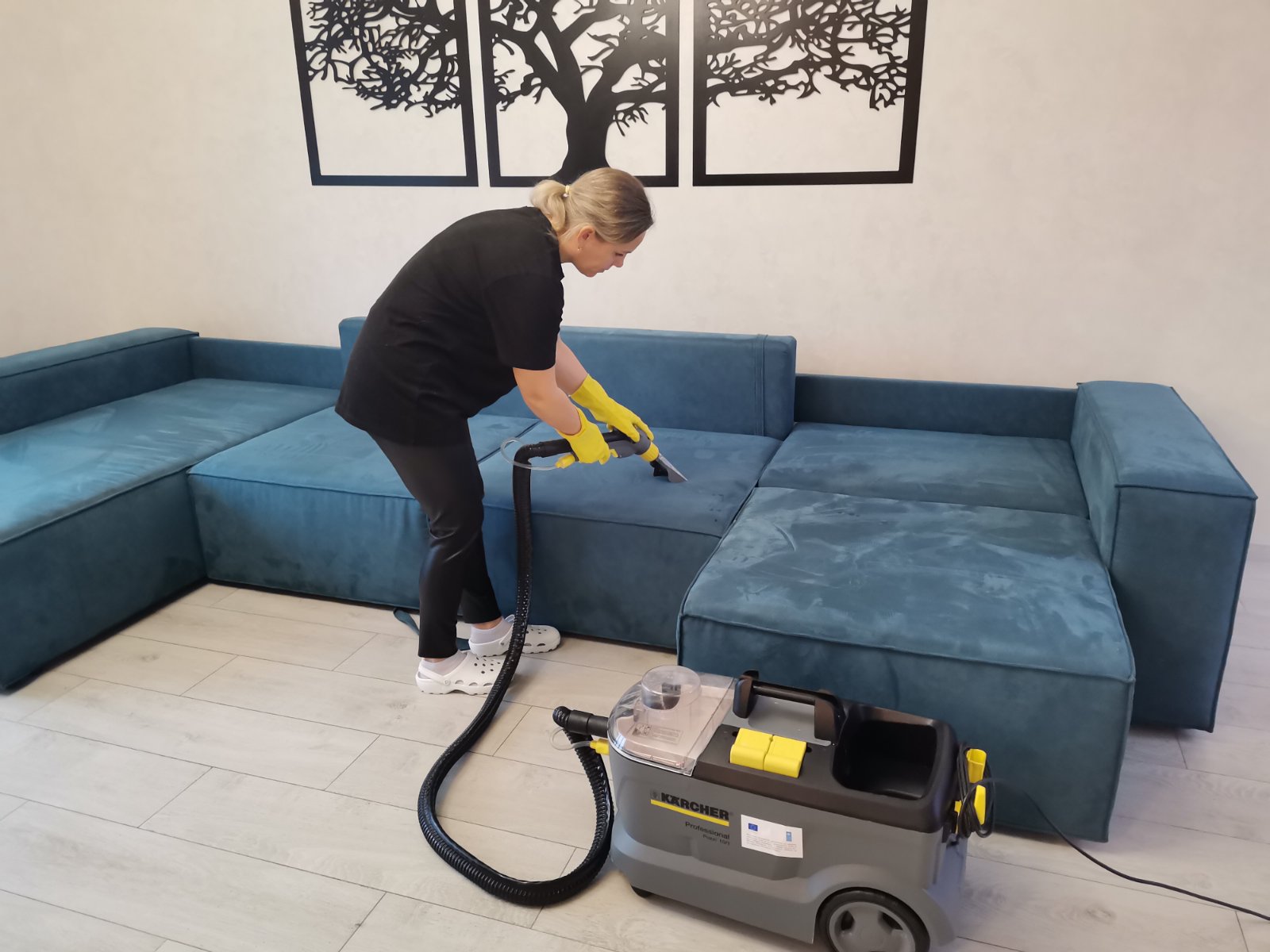 A woman cleaning with a vacuum cleaner