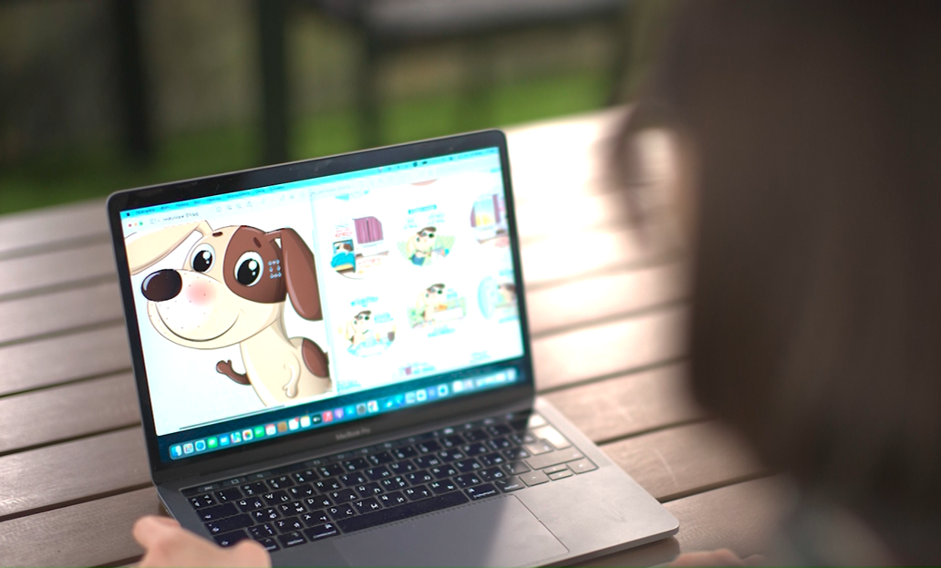Notebook with an animated pet dog on screen