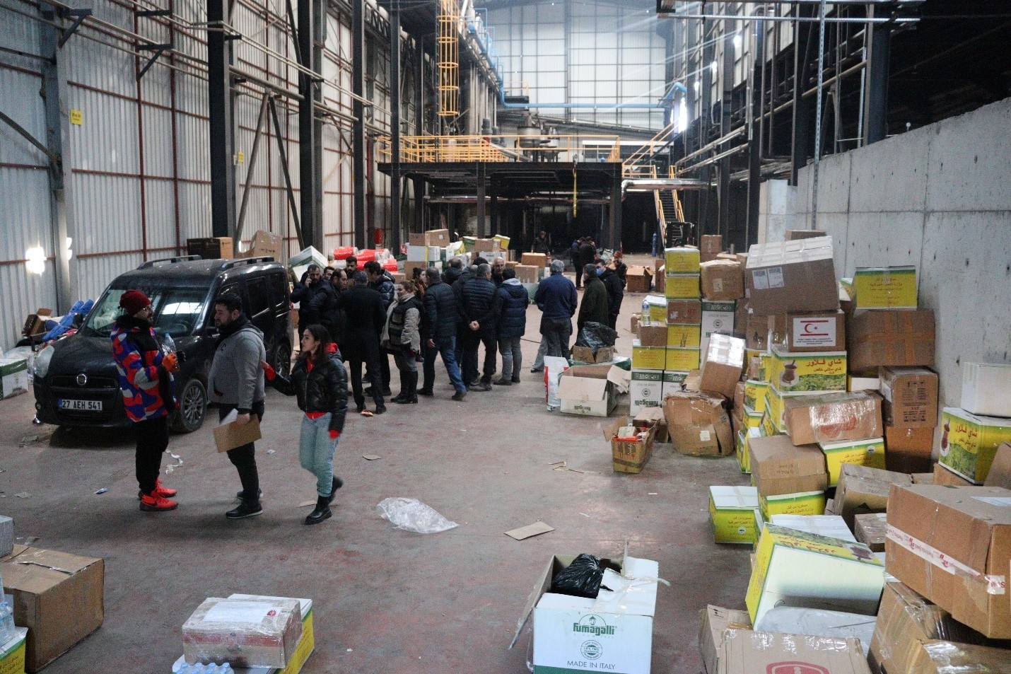 Volunteers in a warehouse with donated goods