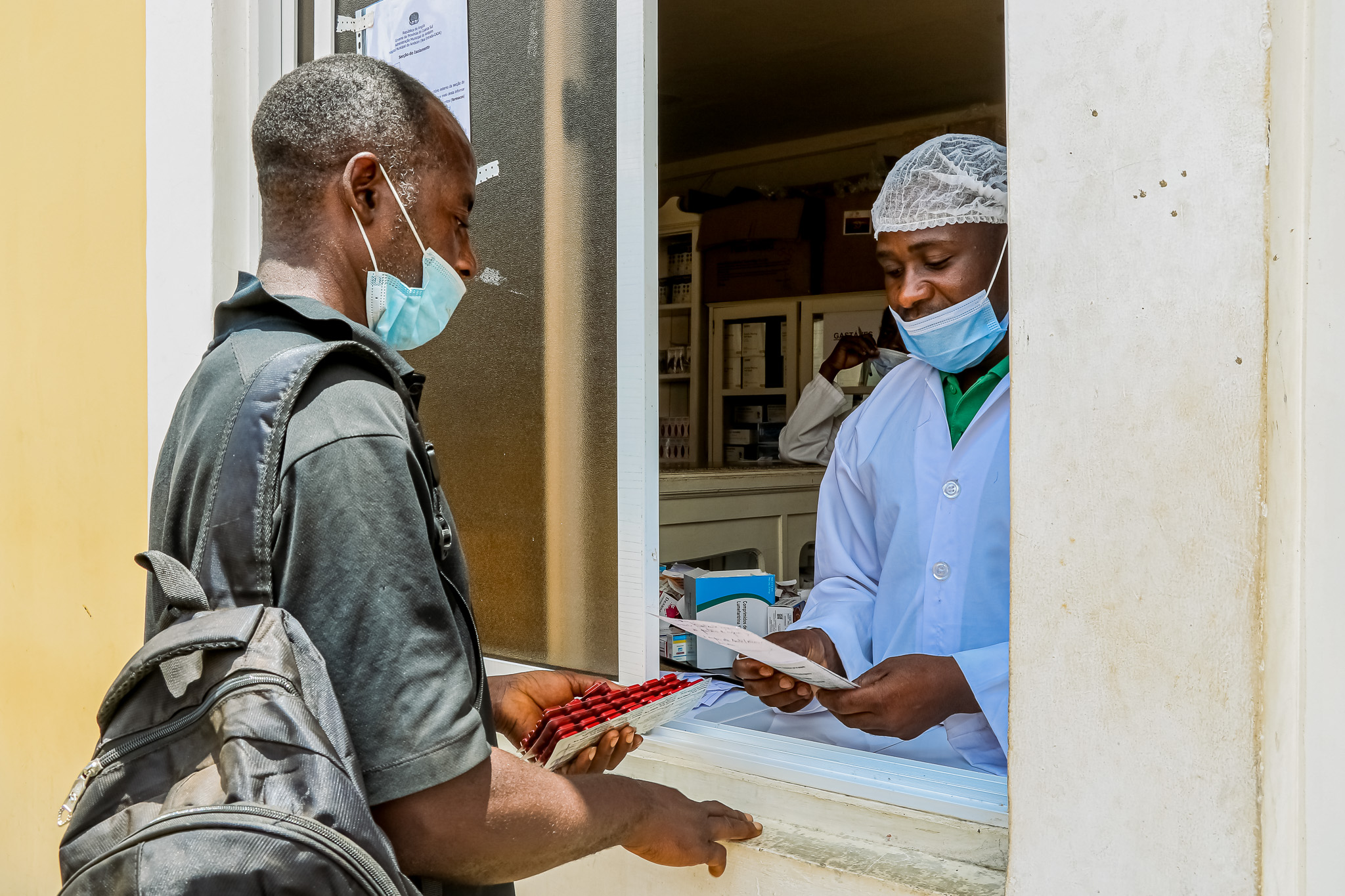 Patient receiving TB medication from a clinic