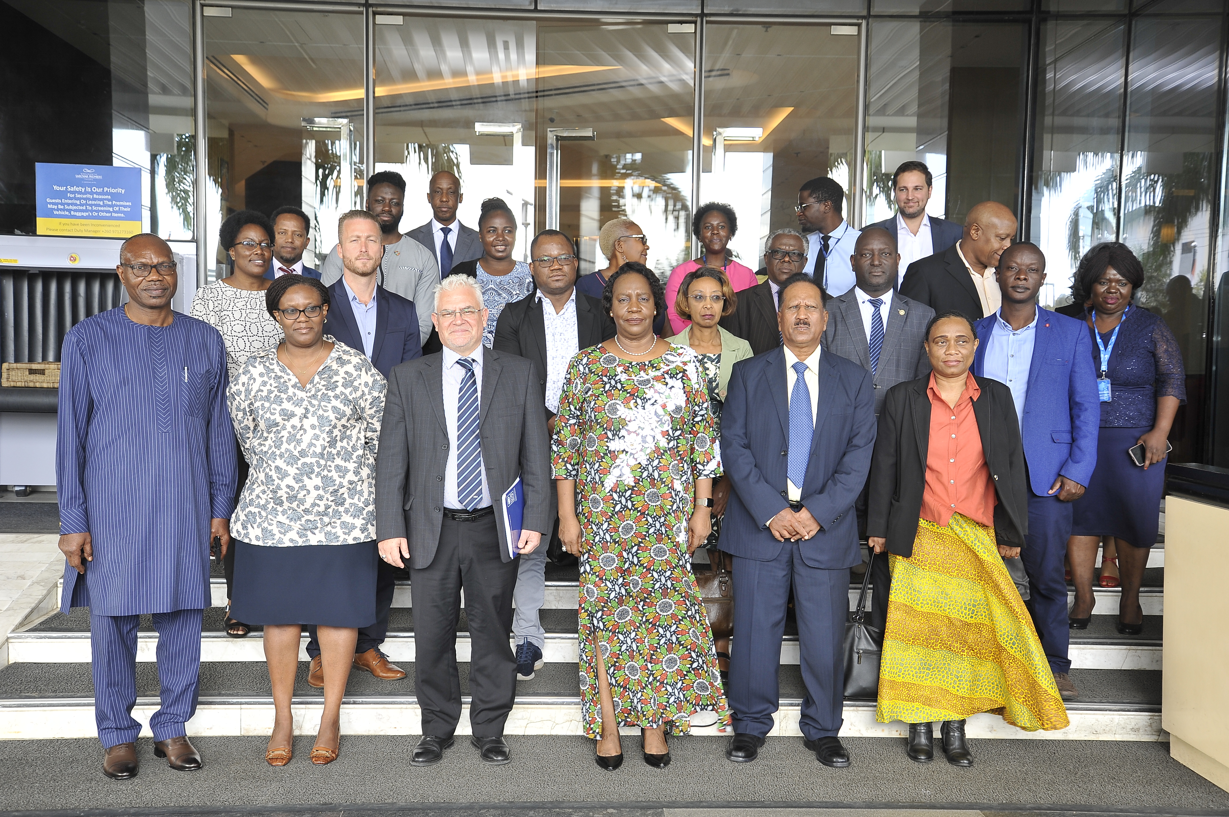 A group photo of the COMESA Secretary General, Her Excellency Chileshe Kapwepwe (Centre), UNDP Zambia Resident Representative, Lionel Laurens (Centre Left), and COMESA Assistant Secretary General, Dr Dave Haman (Centre Right) with participants at the COMESA-UNDP Partnerships Dialogue