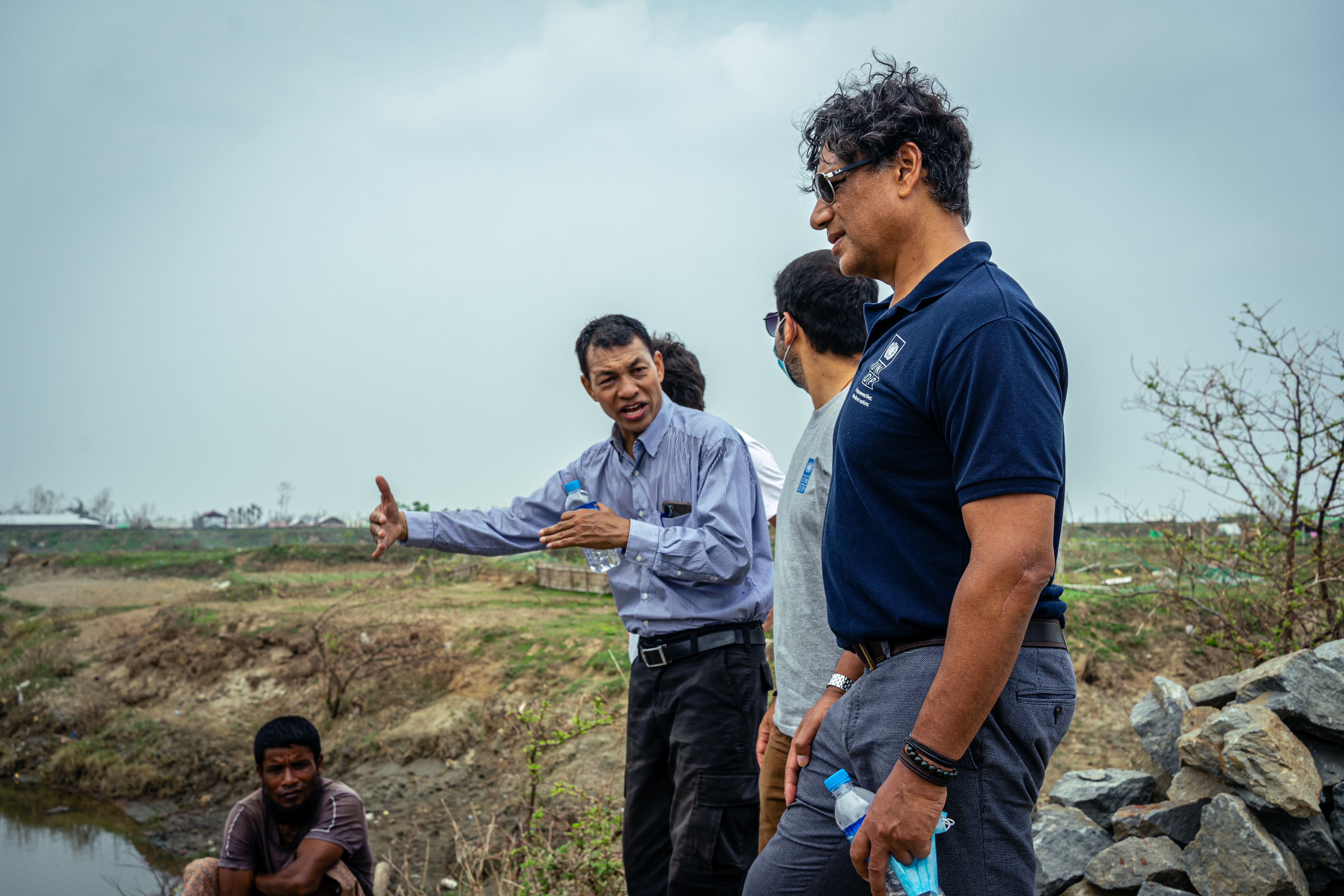 Titon Mitra, UNDP Myanmar’s Resident Representative, together with Rakhine office team members, visits a bridge destroyed by Cyclone Mocha in Sittwe 