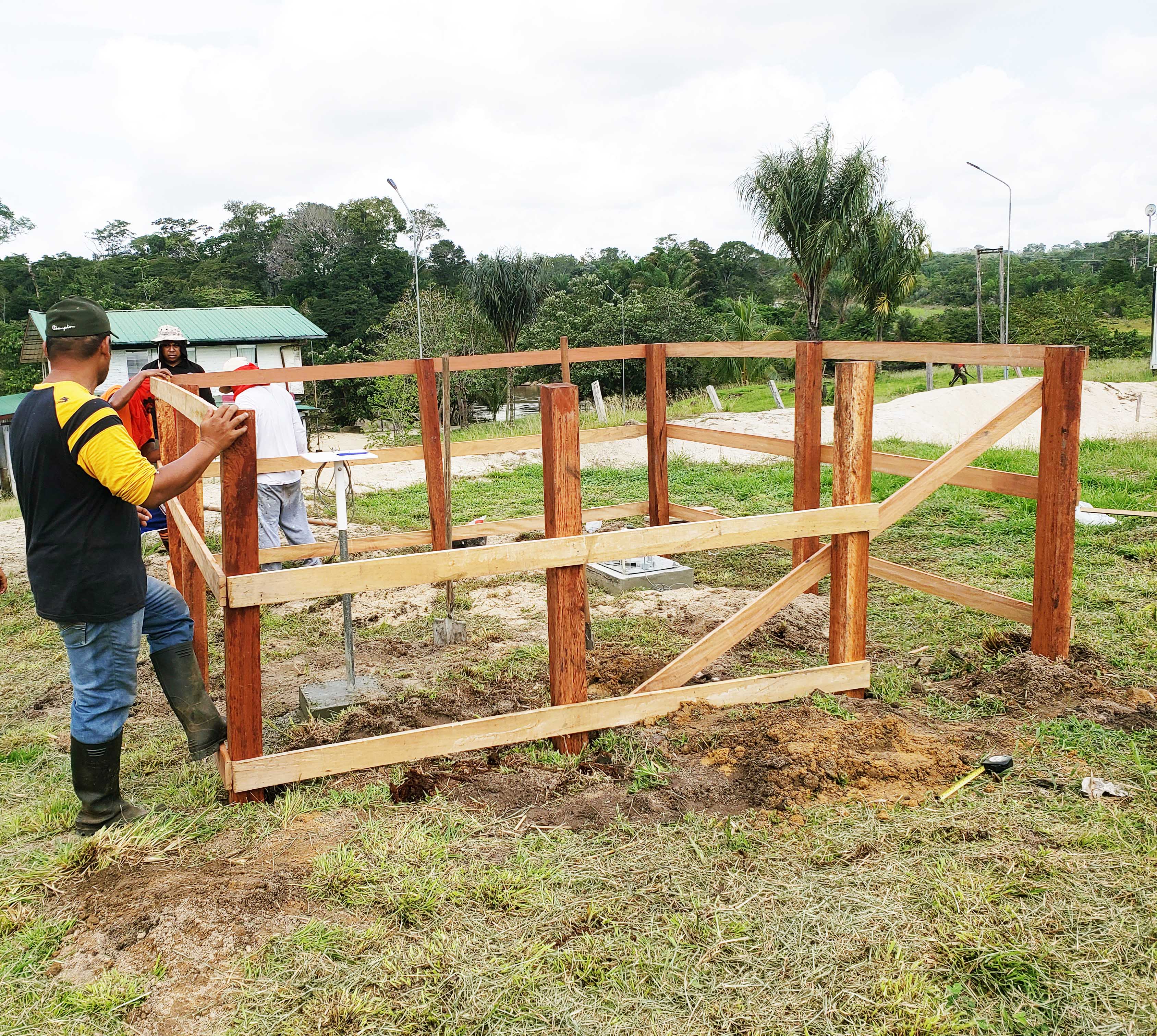 Concrete landfilling and fencing for the AWS installation by Mr. G. Paiman and 2 staff members of the Technical Department of The Ministry of Public Works: Irosemito R. and Wongsodihardjo R