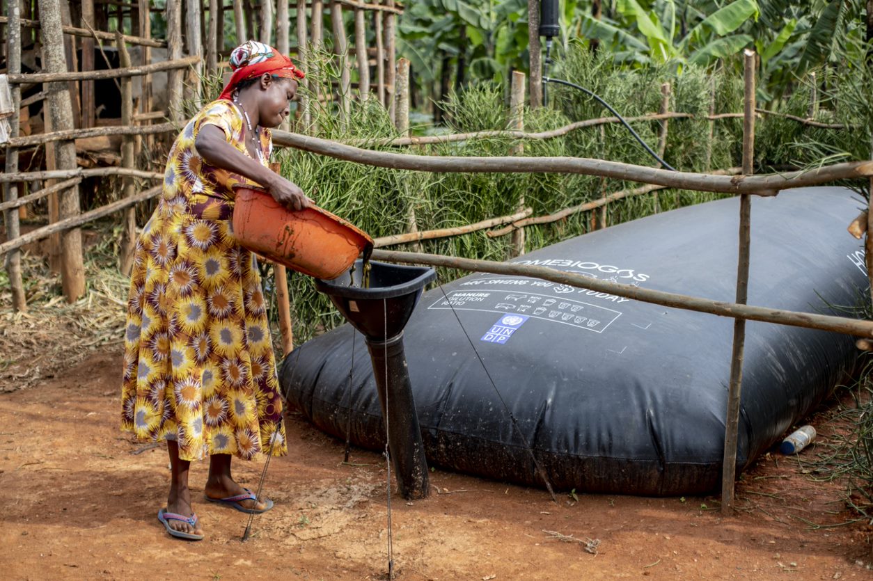 A woman oparating the biogas equipment