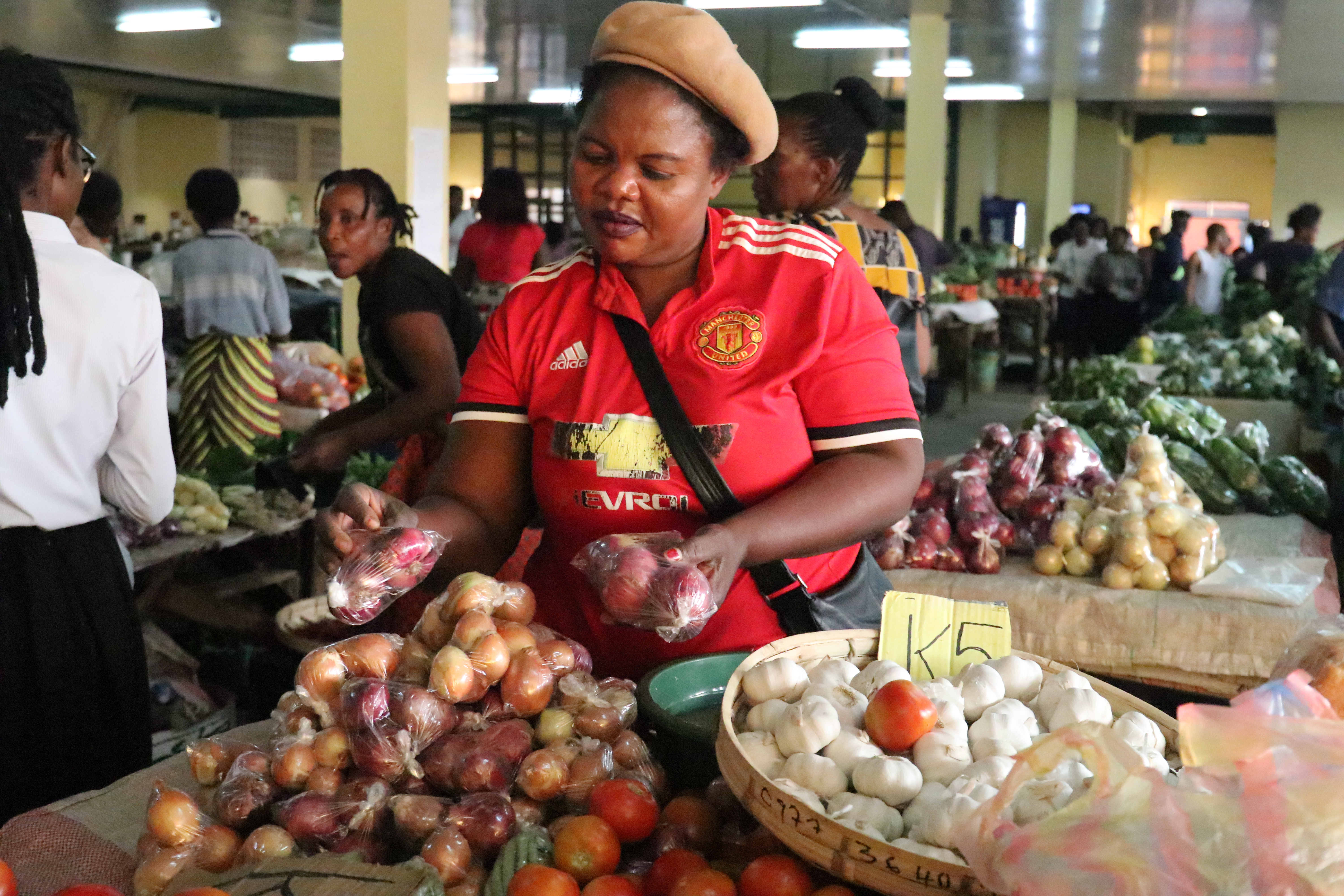 An image of a member of the Livingstone Cross Border Association at her stall in the Livingstone City Market
