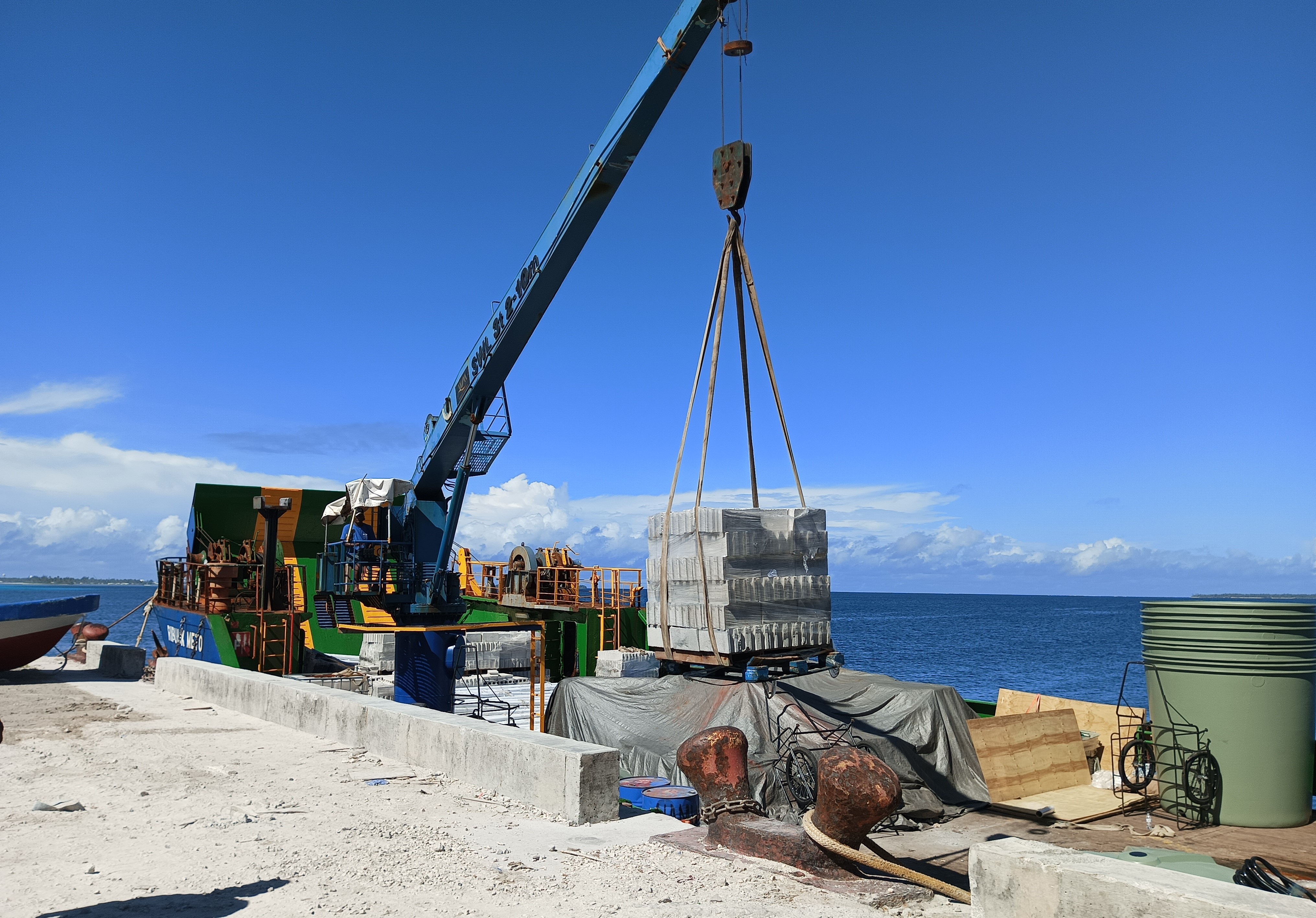 Unloading materials at Ebeye dock in Kwajalein Atoll