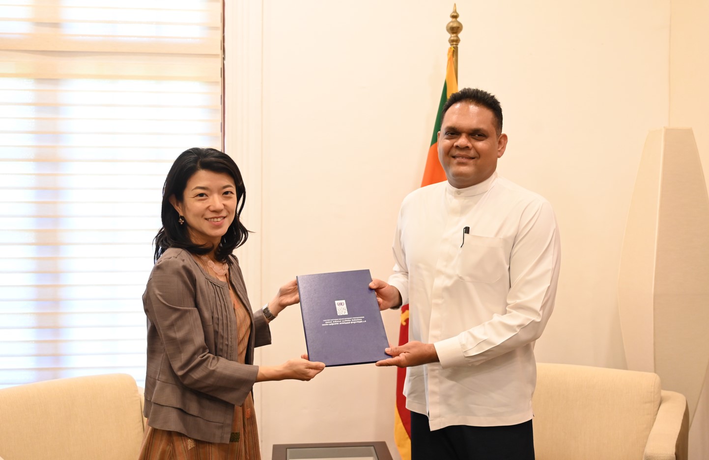 UNDP RR hands over report to State Minister of Finance