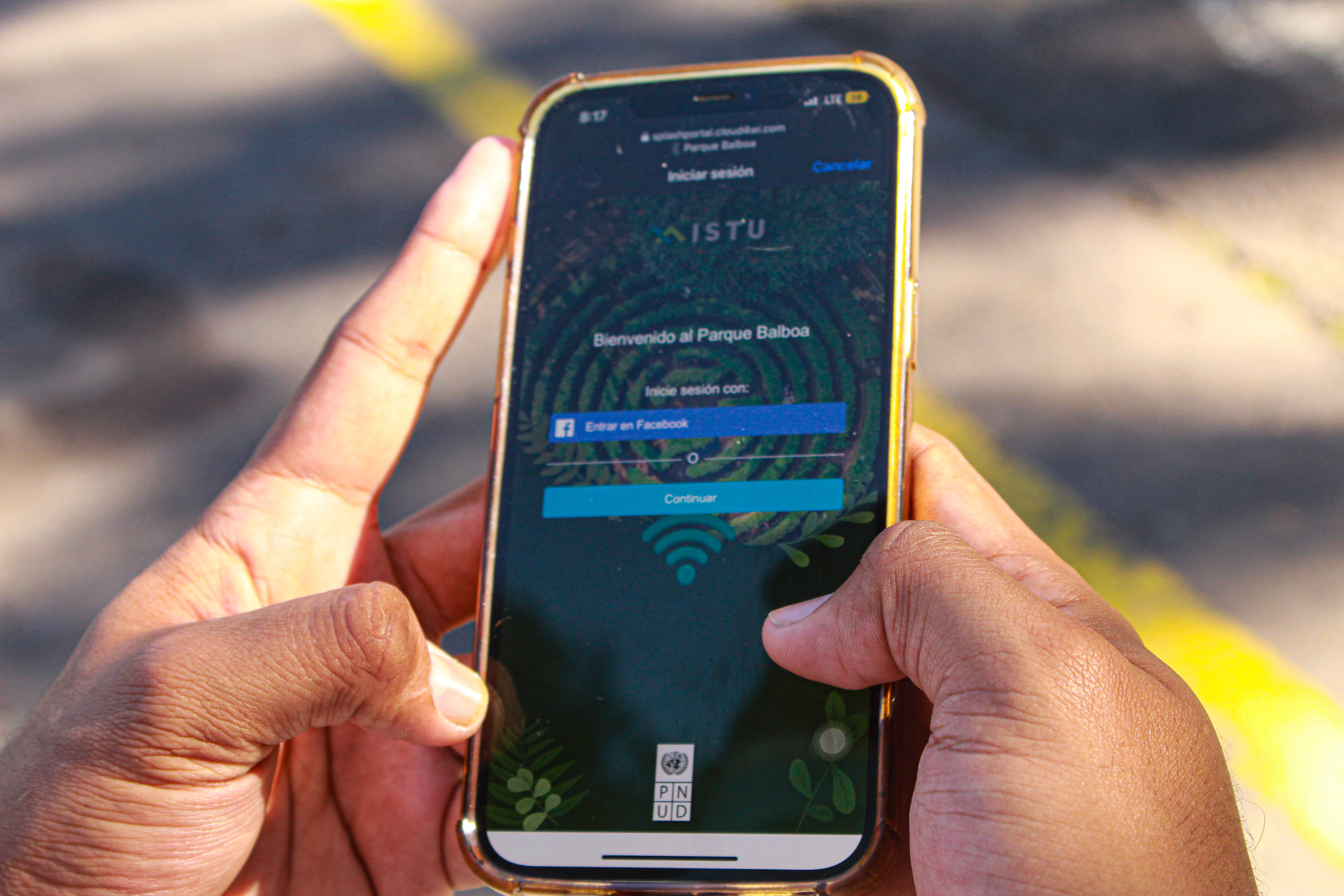 Mobile device screen connecting to Balboa Park's public space