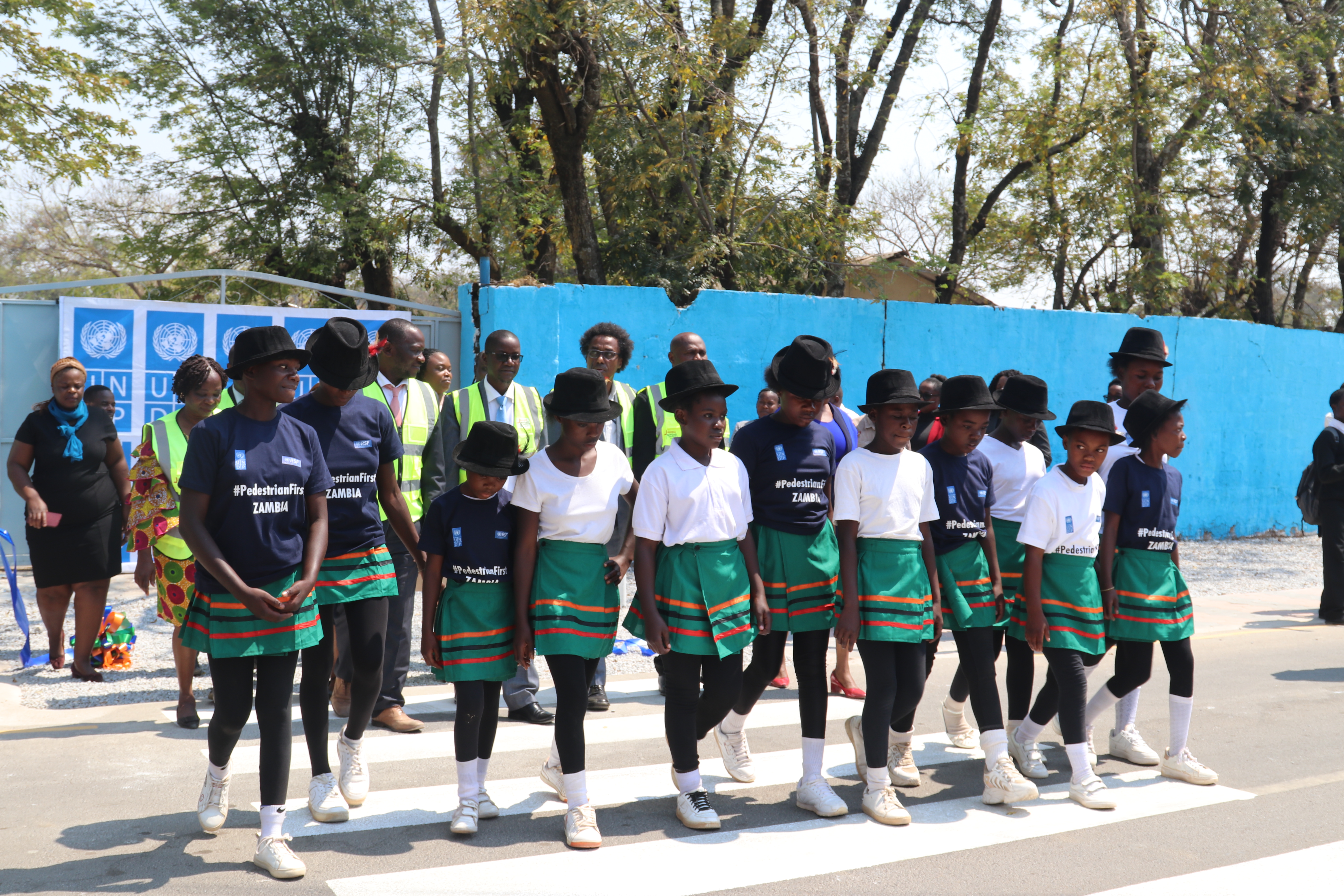 Student at Jacaranda Combined School crossing the newly painted zebra crossing at the Launch of Safe Schools Infrastructural Improvements in Lusaka