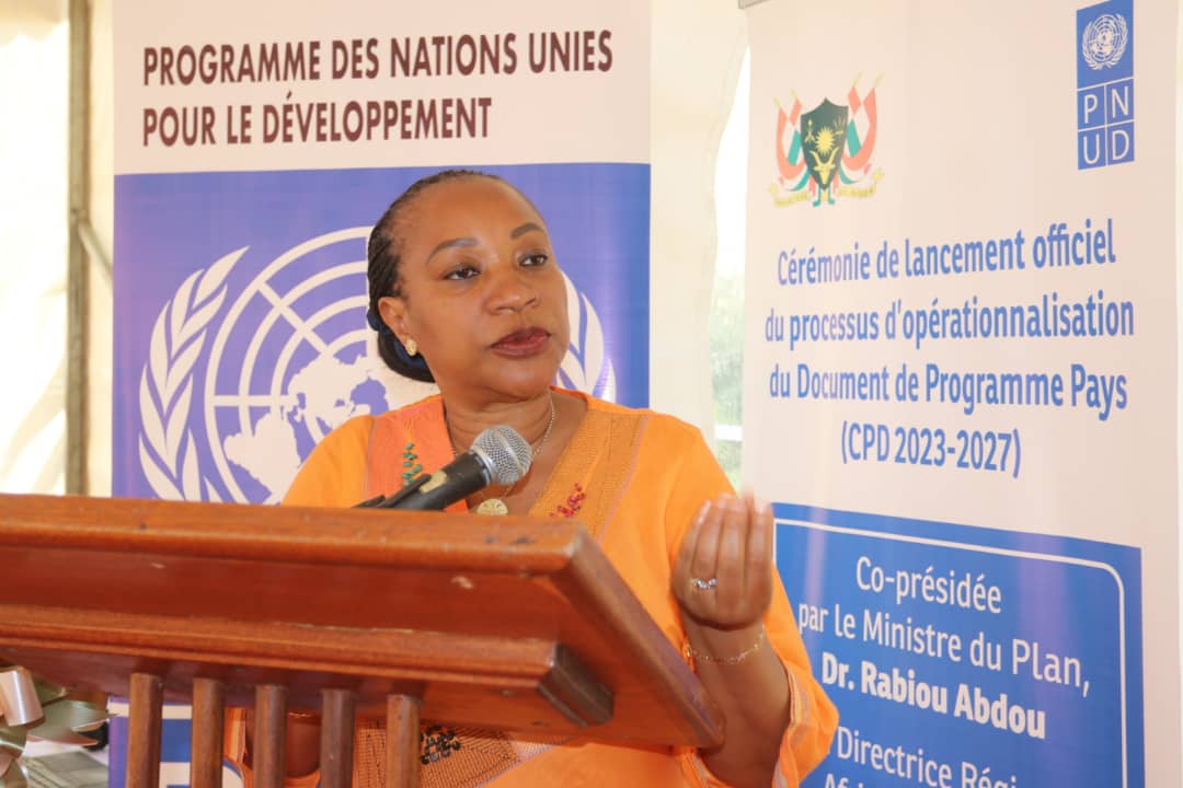 UNDP Niger RR Nicole Kouassi standing behind podium