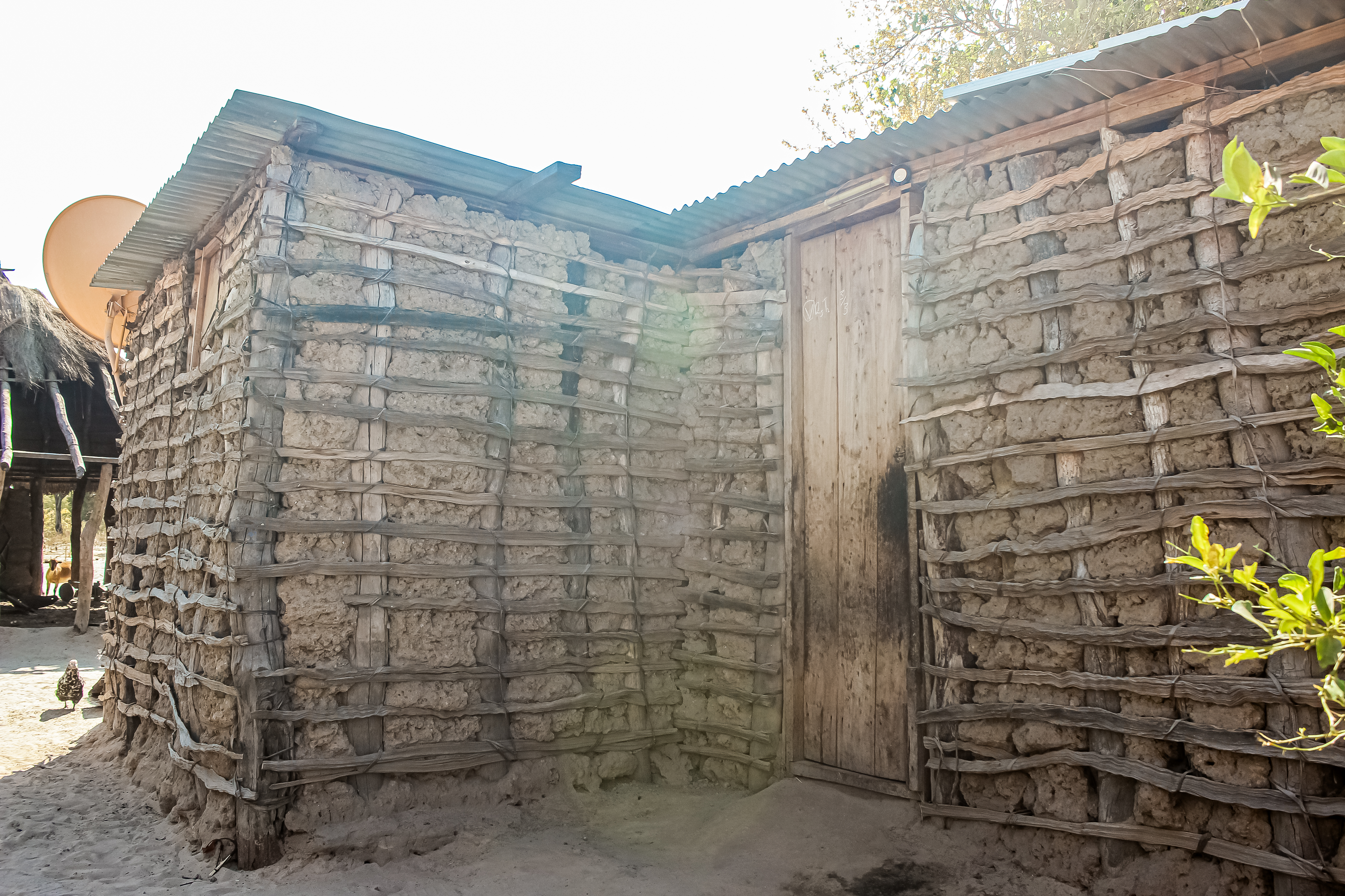 An image of Nanswau's mud brick home with iron roofing sheets