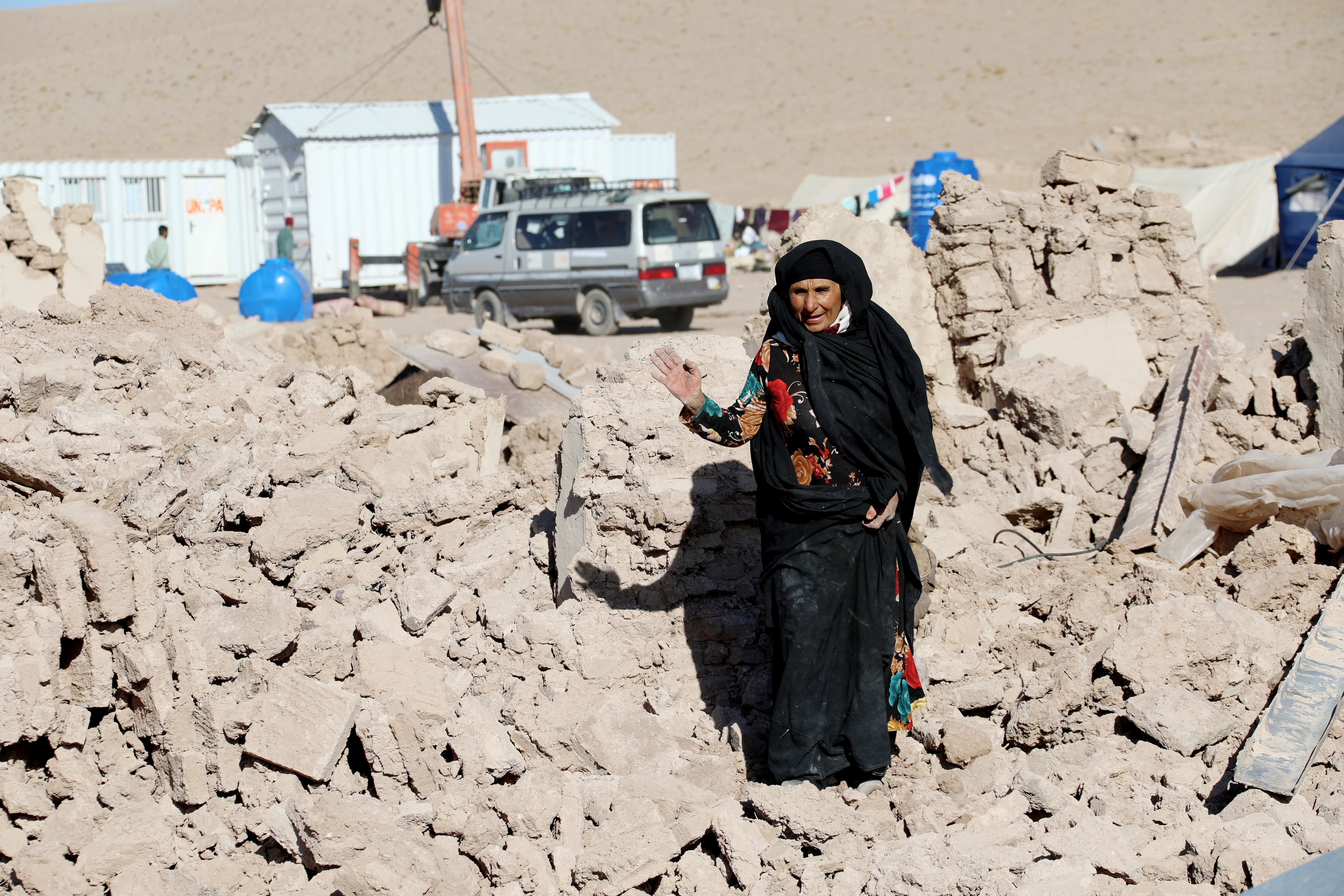Woman standing in the rubble after earthquake