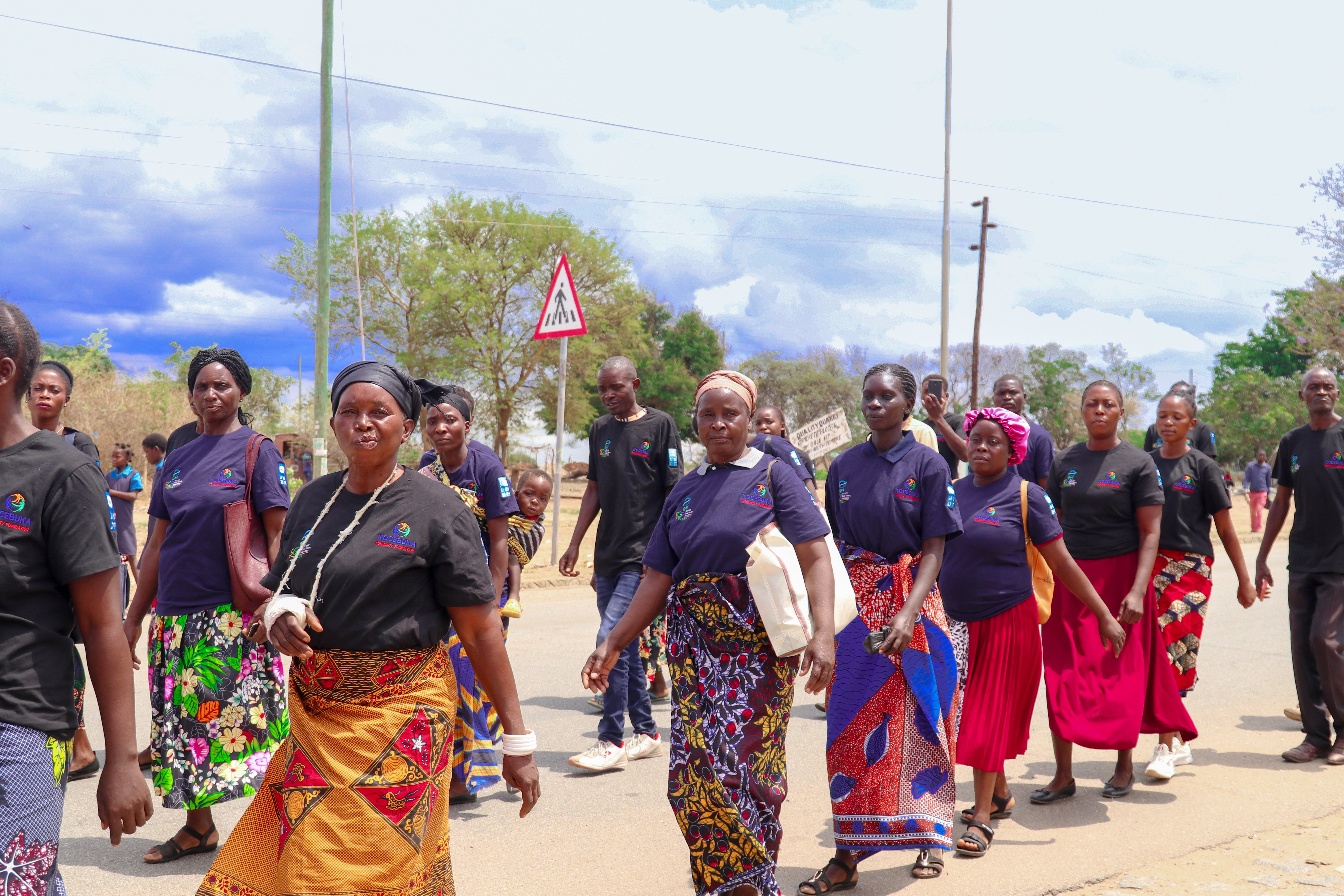 Image of women marching at the launch of Kocebuka Community Foundation project in Zimba