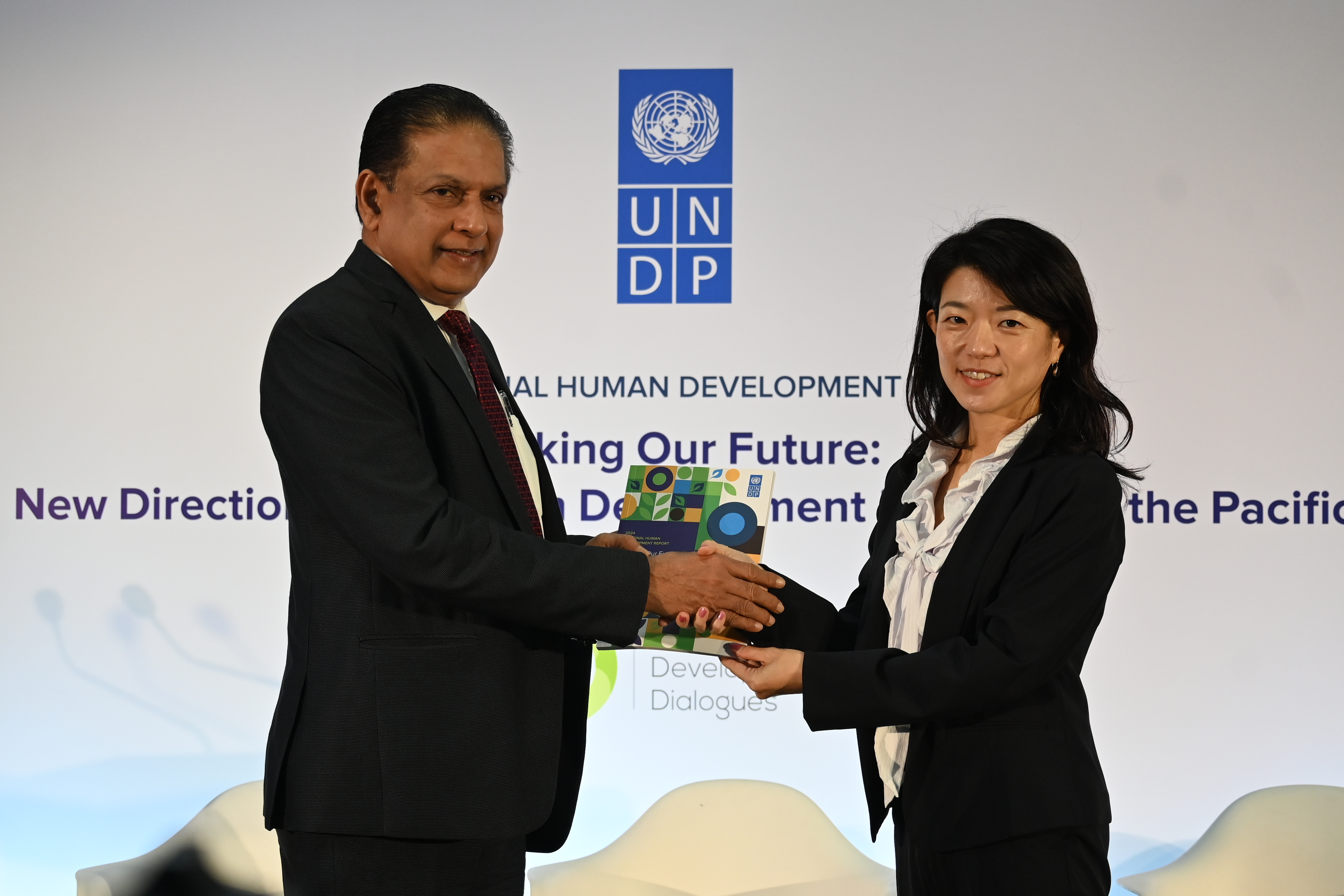Ms Azusa Kubota, Resident Representative, UNDP in Sri Lanka officially hands over a copy of the Regional Human Development Report