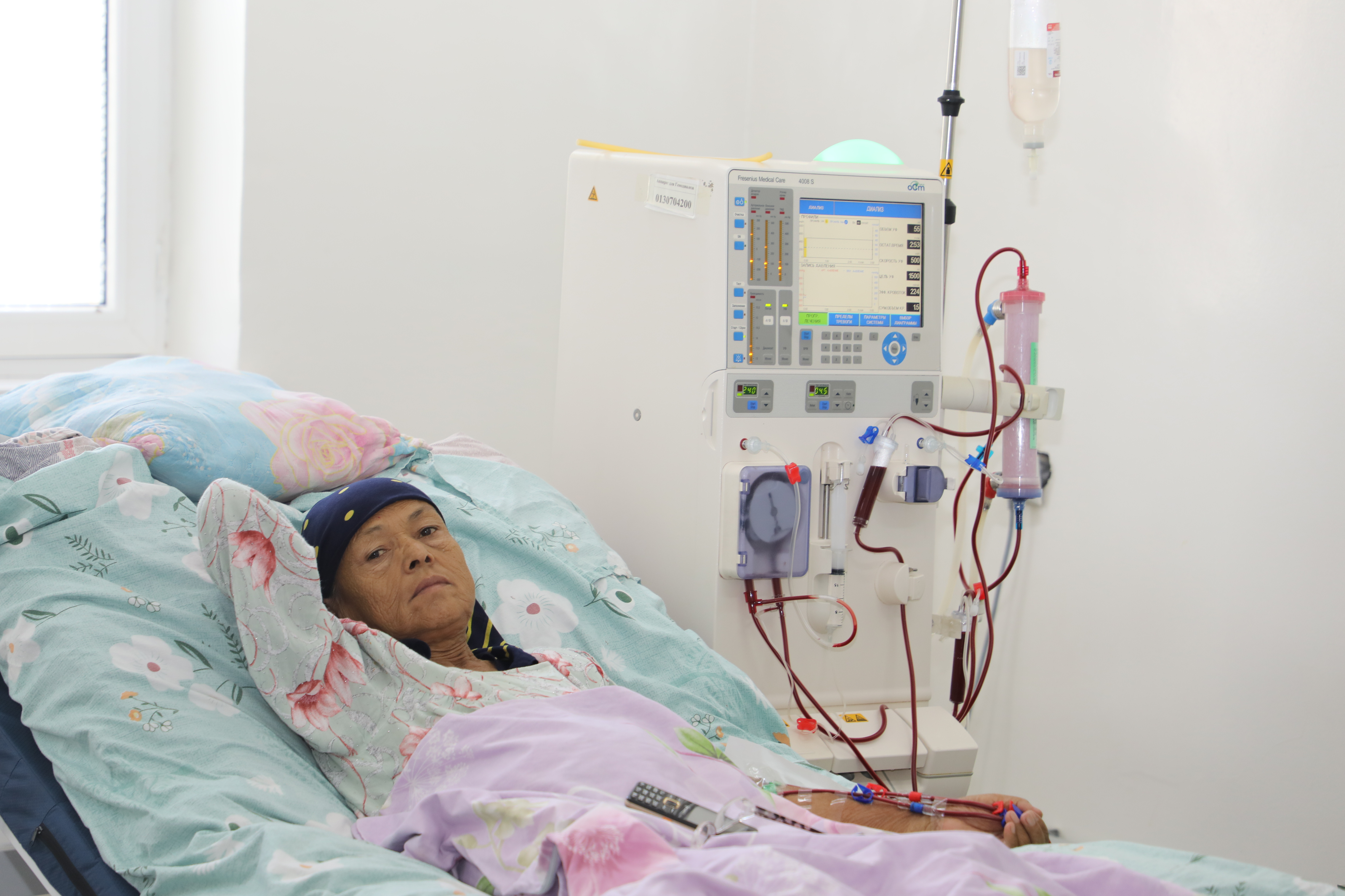 a woman in hospital receiving dialysis treatment