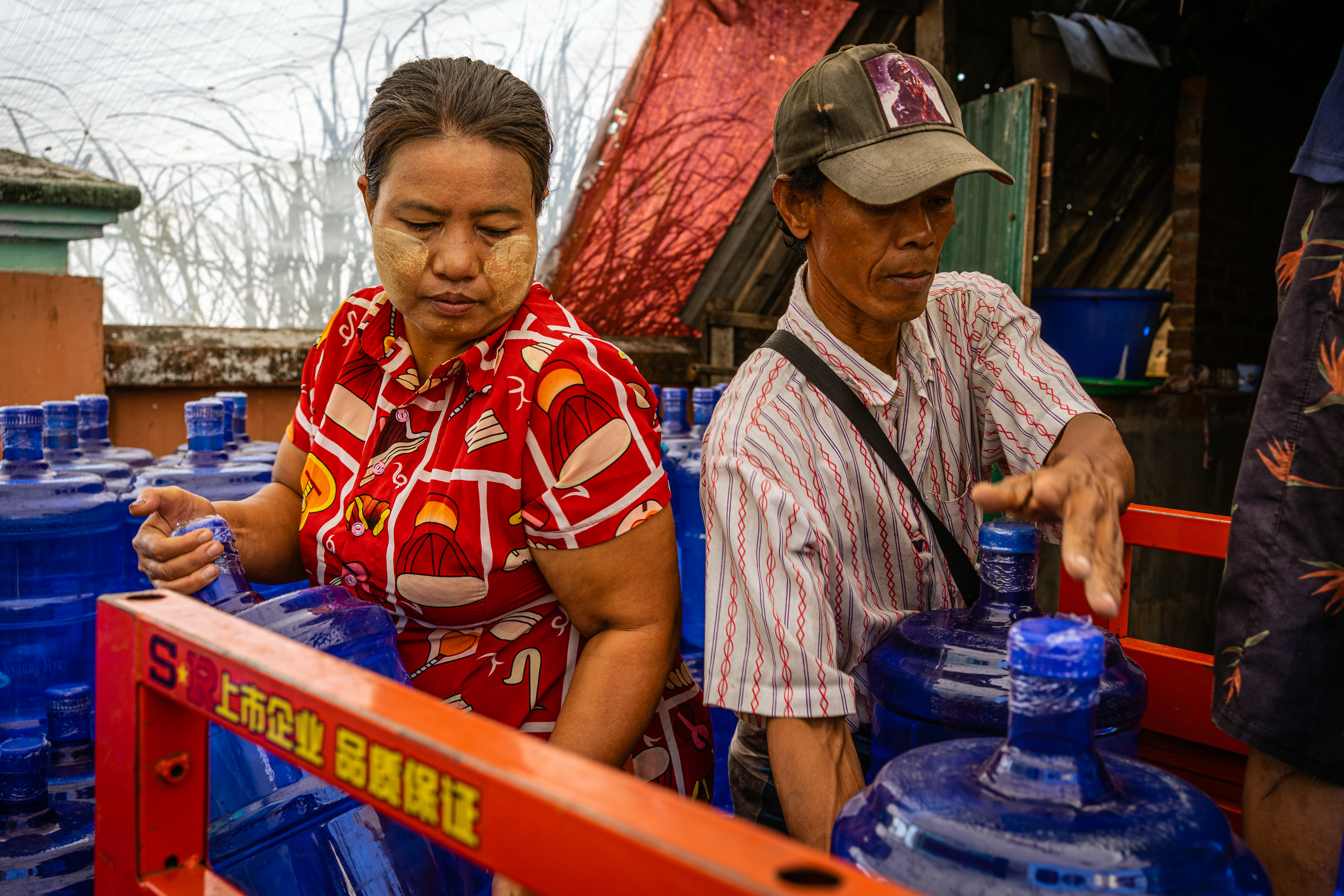 Rather than truck in water, UNDP and WaterAid workers are supporting people to create micro-enterprises to distribute water to people, in low-income areas in Yangon