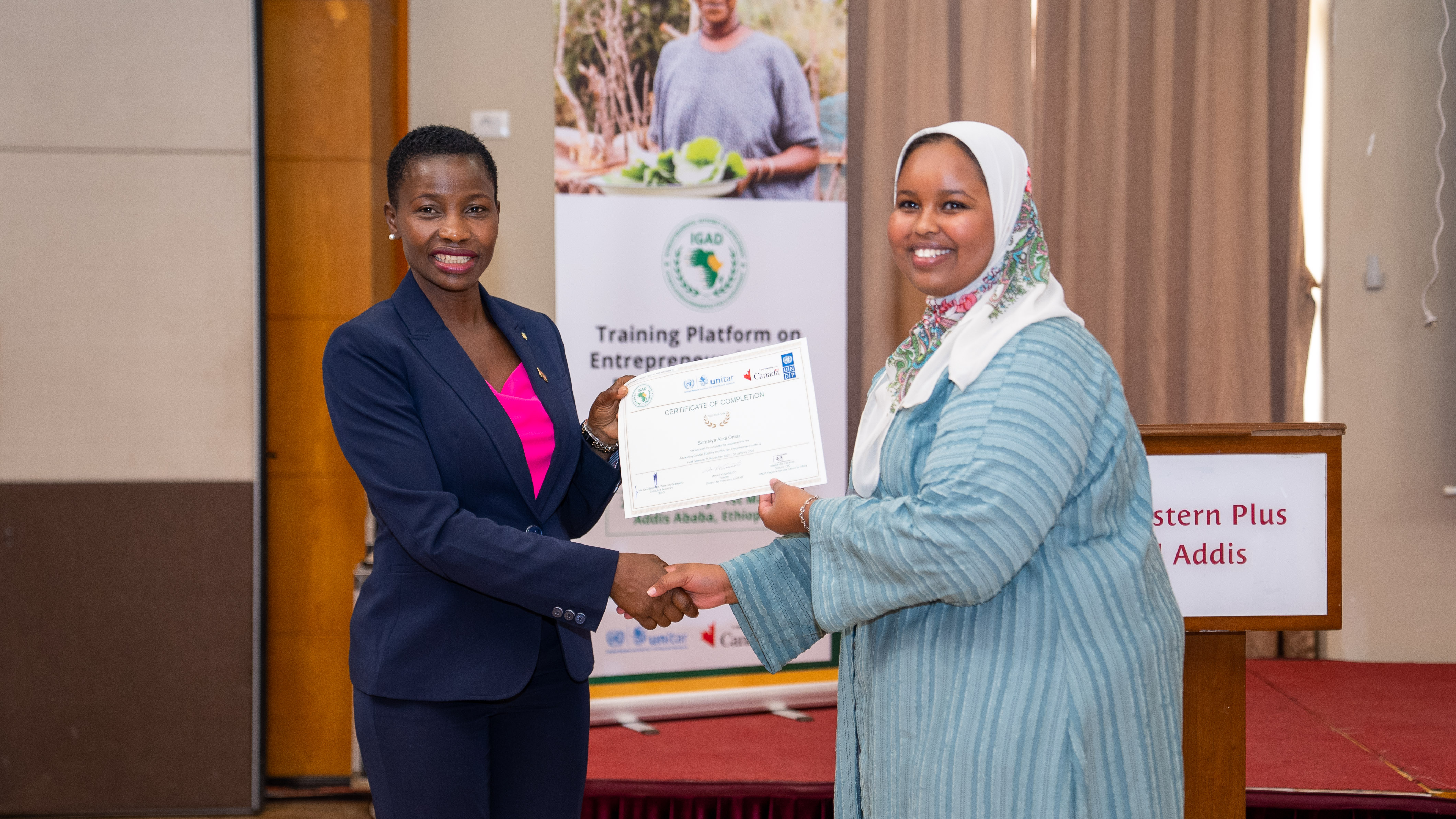 Figure 1 Sumaiyah Omar Presented with her certificate of completion during the In Person Entrepreneurship Training held by UNDP, UNITAR and IGAD