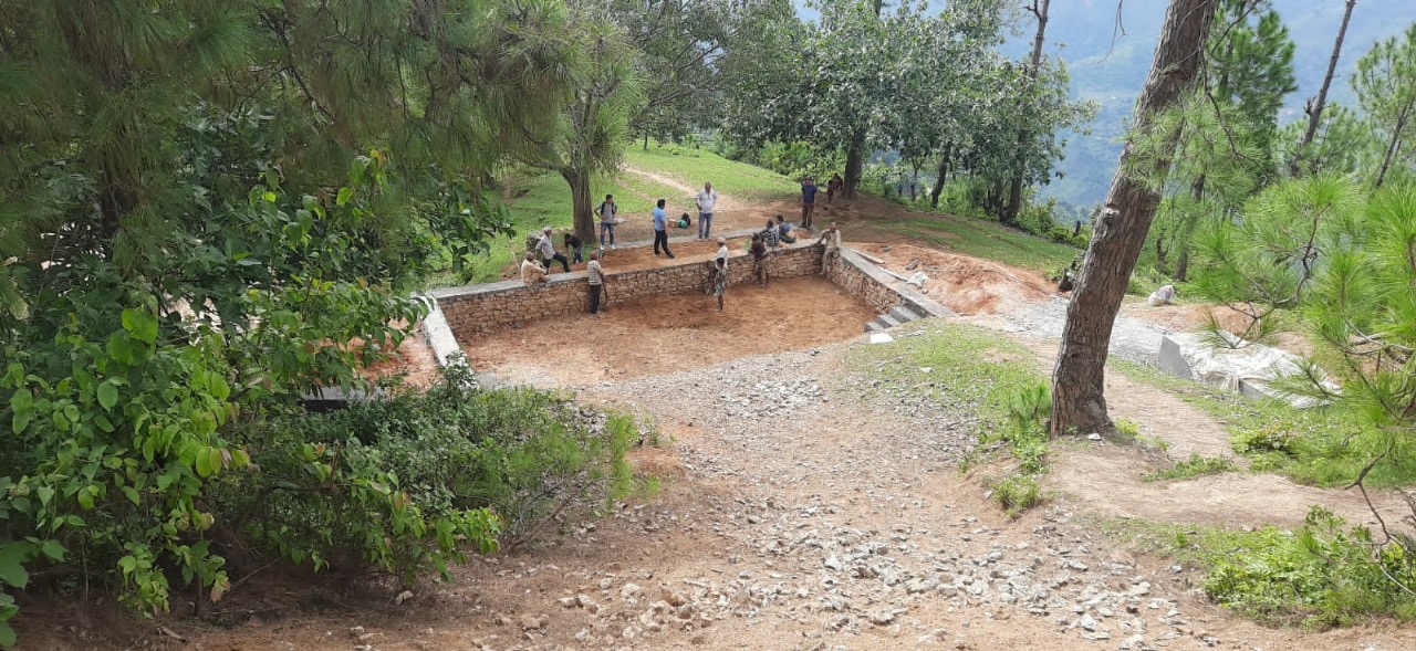 people building a water storage facility