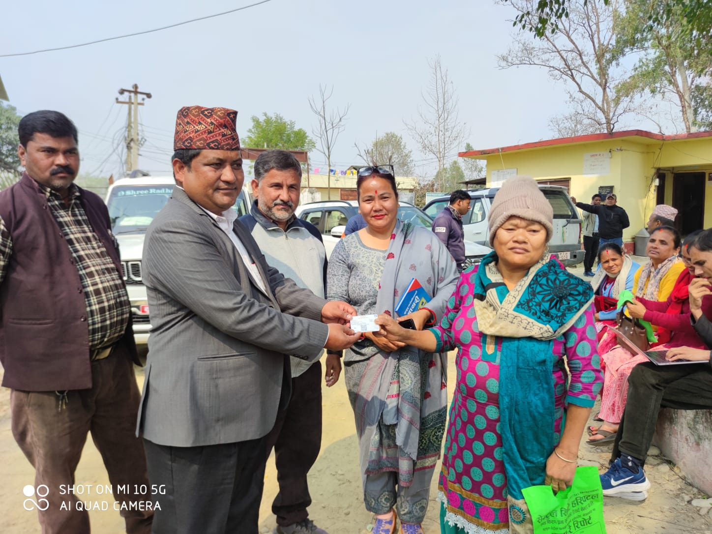 Khajura mayor Dambar Bahadur BK distributing digital card