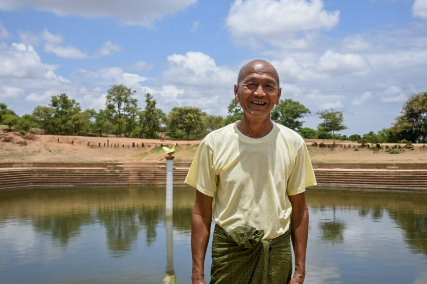 U Maung Win poses by the newly renovated pond 