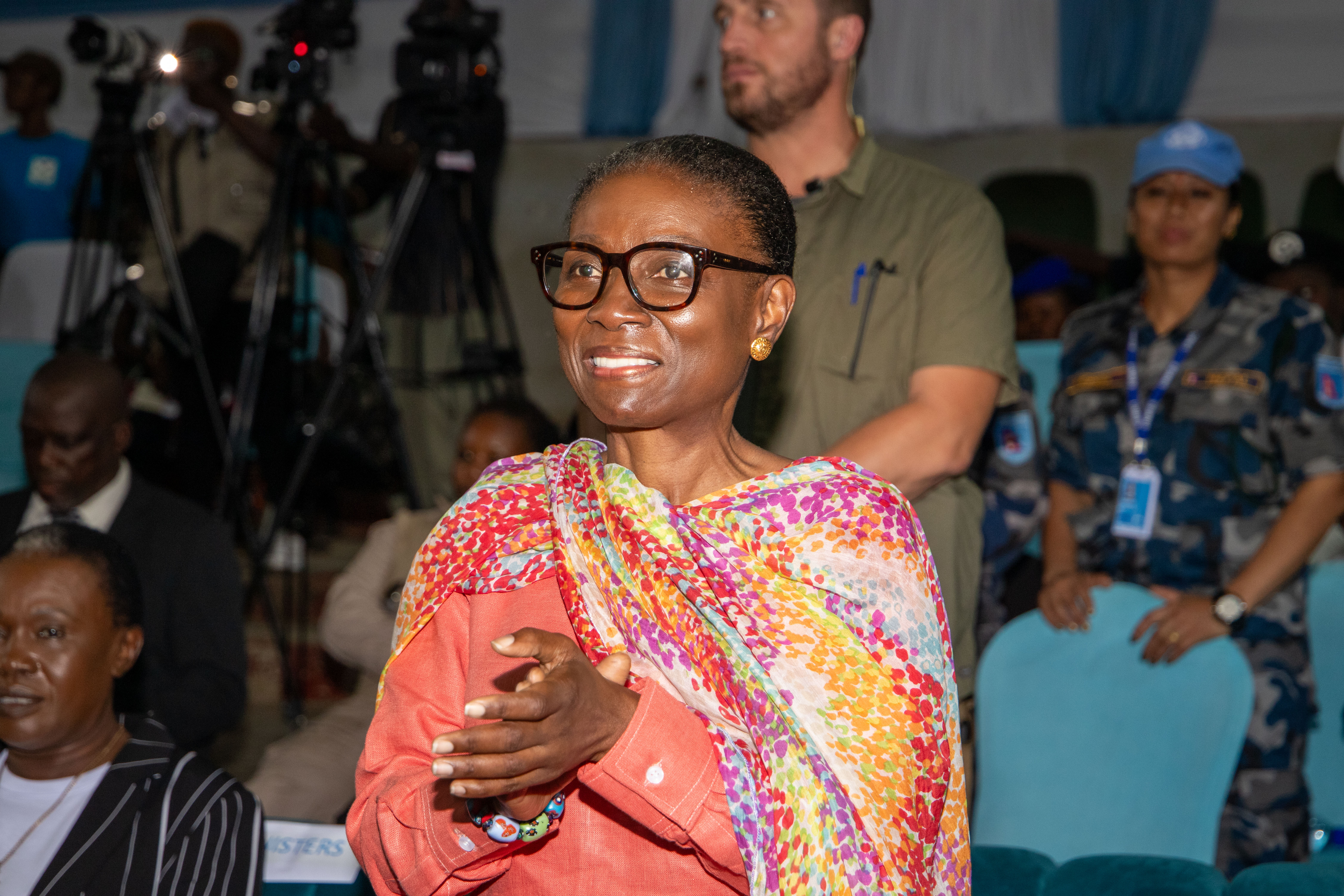 a man and a woman looking at the camera