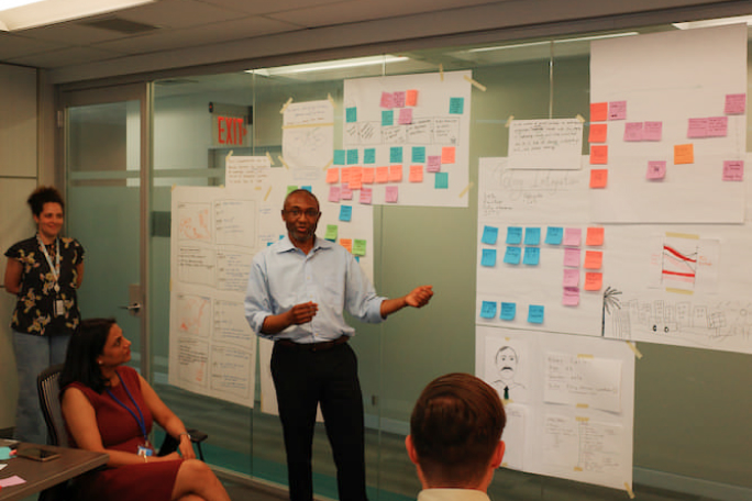 a group of people standing in a room