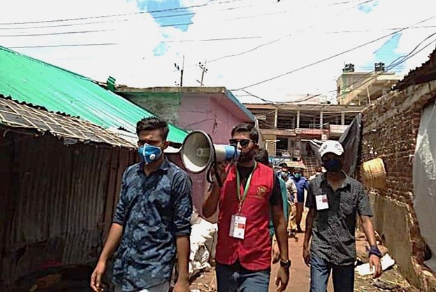 a group of people standing in front of a building