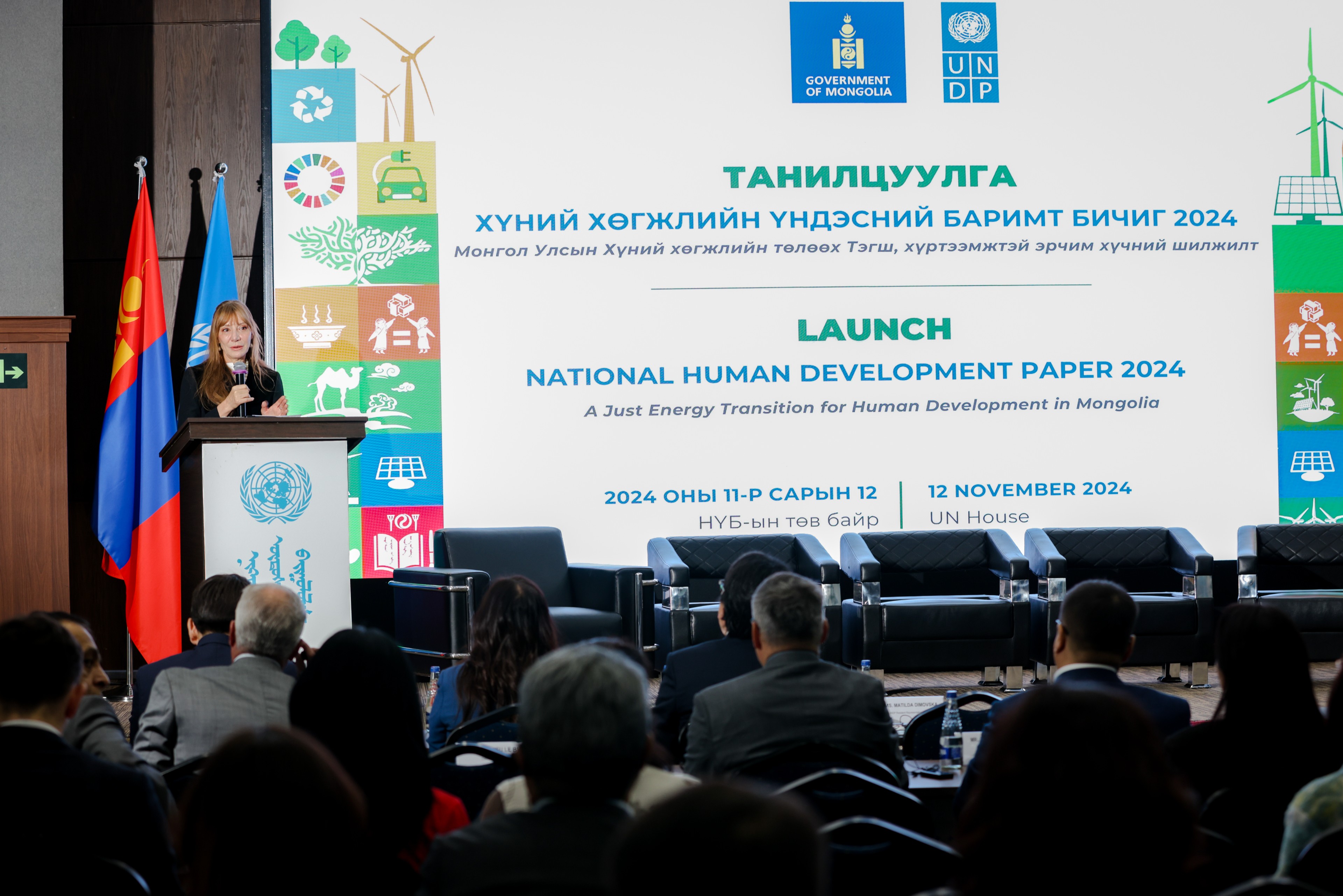 a group of people sitting in front of a crowd