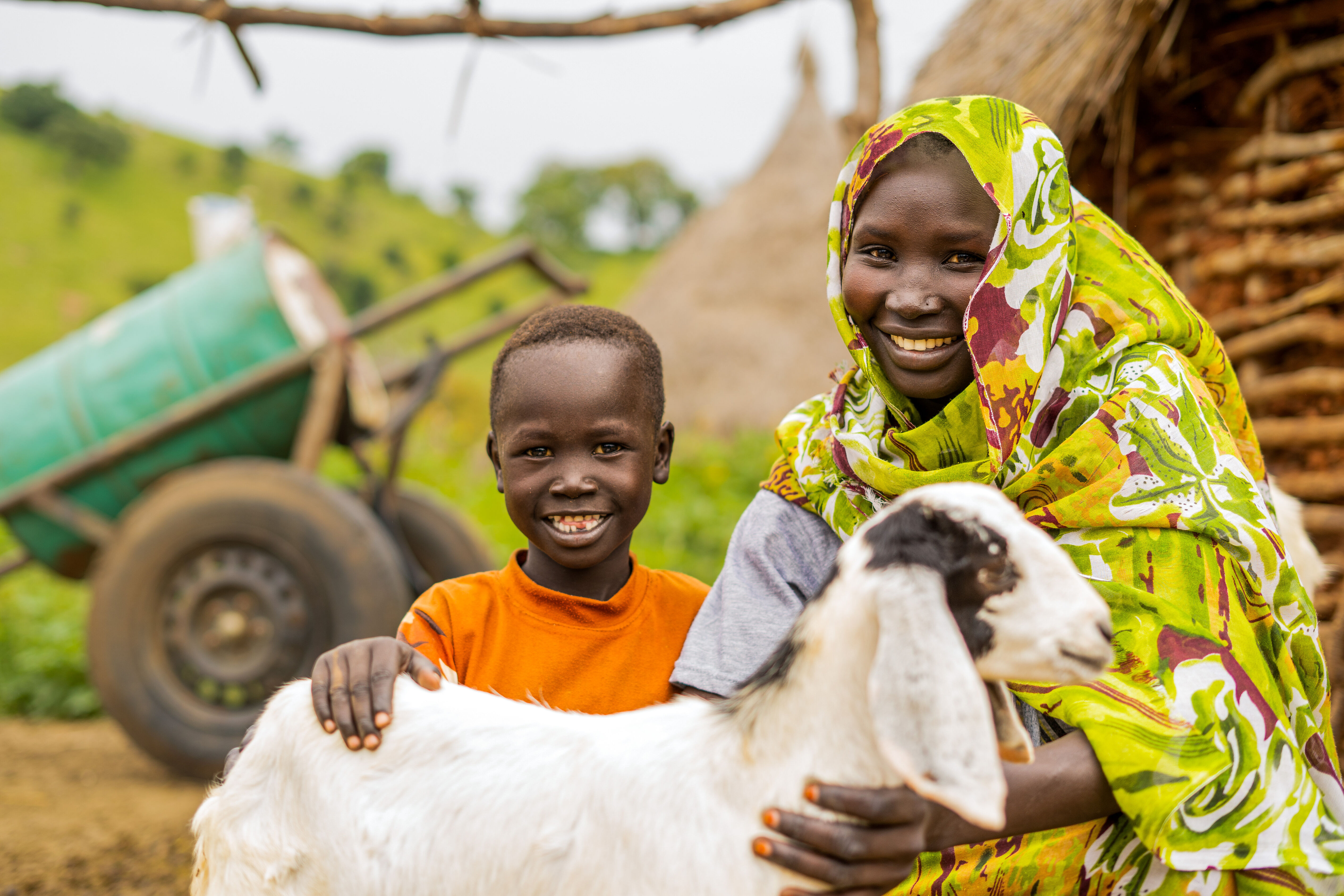 a young boy holding a dog