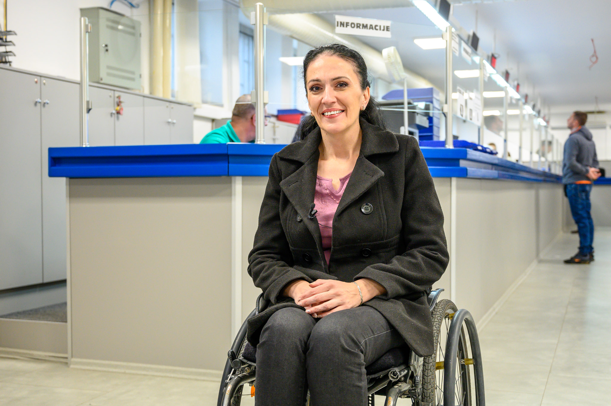 a woman sitting on a luggage bag