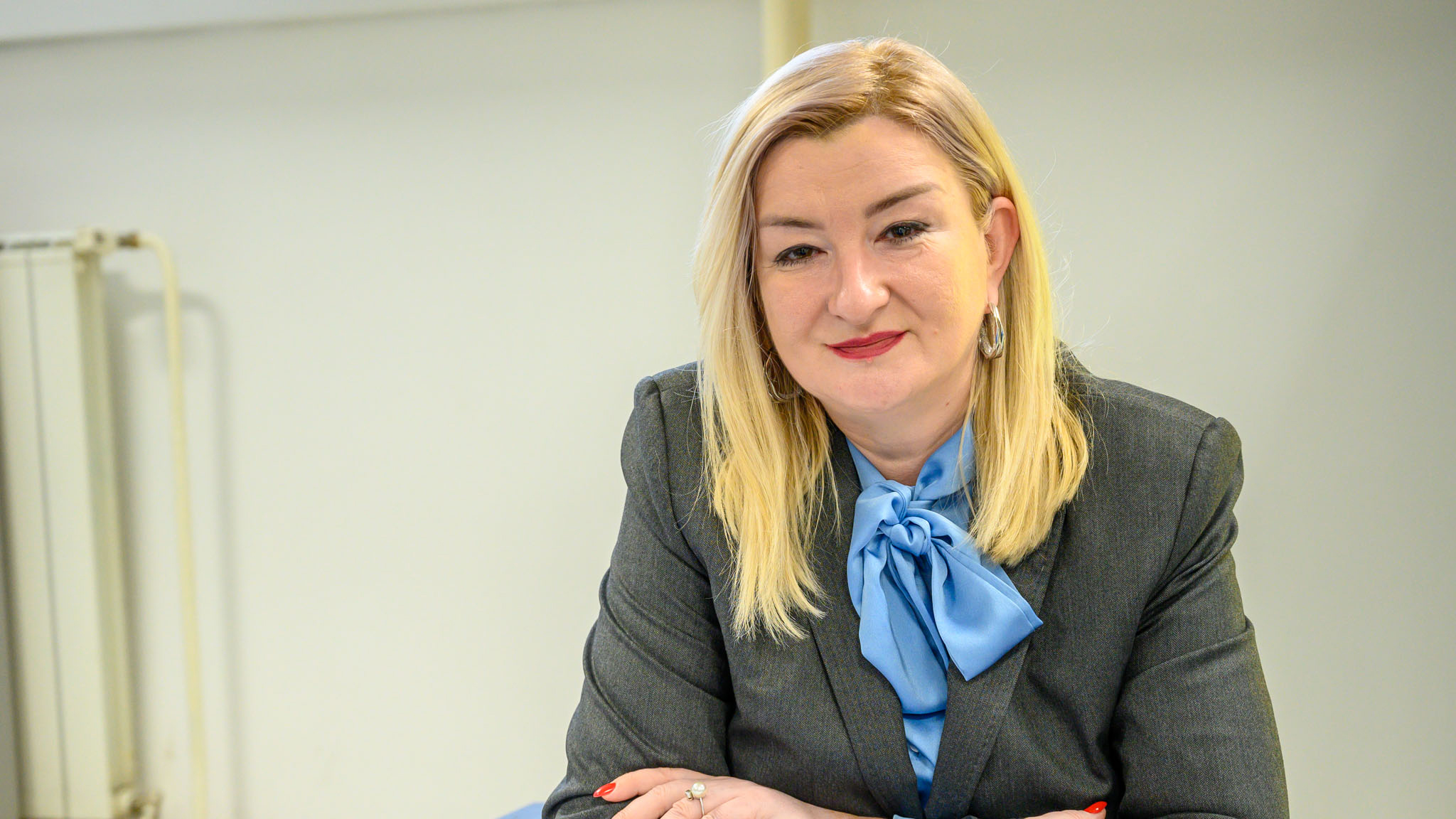 a woman wearing a suit and tie