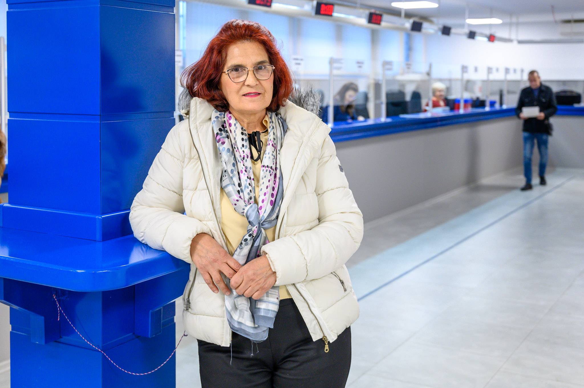 a woman standing in front of a building