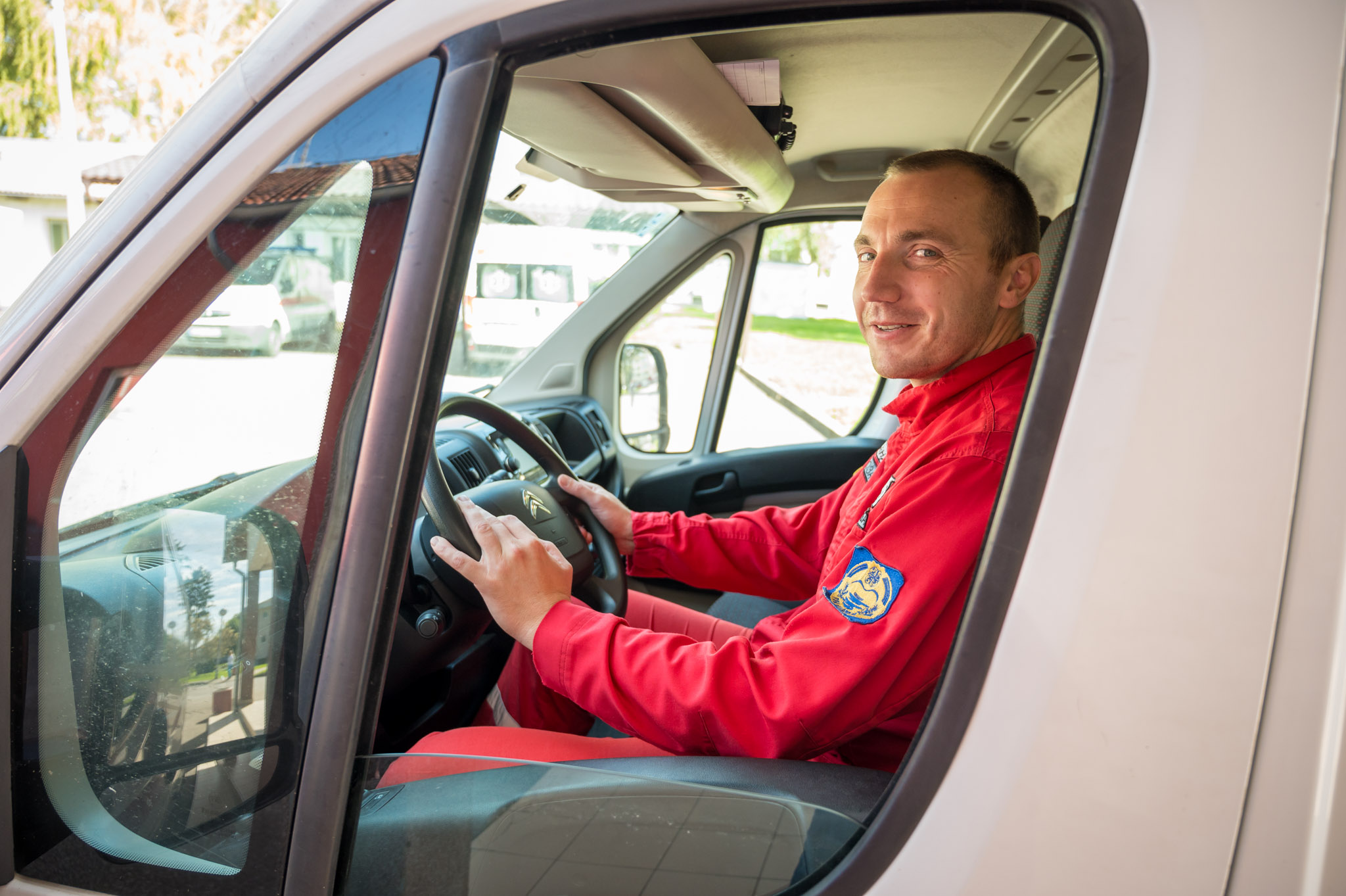 a man riding on the back seat of a car window