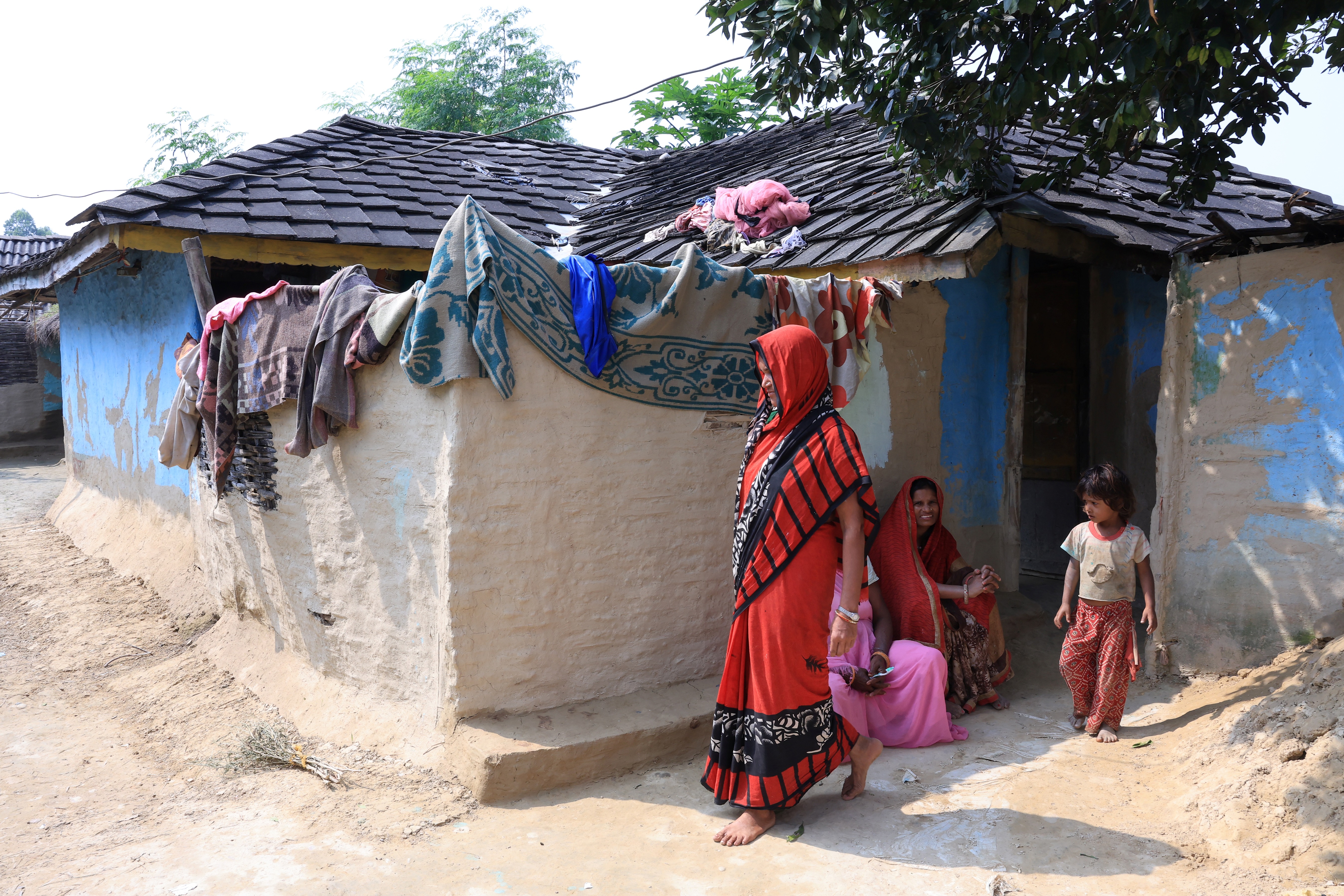 a woman walking outside her house