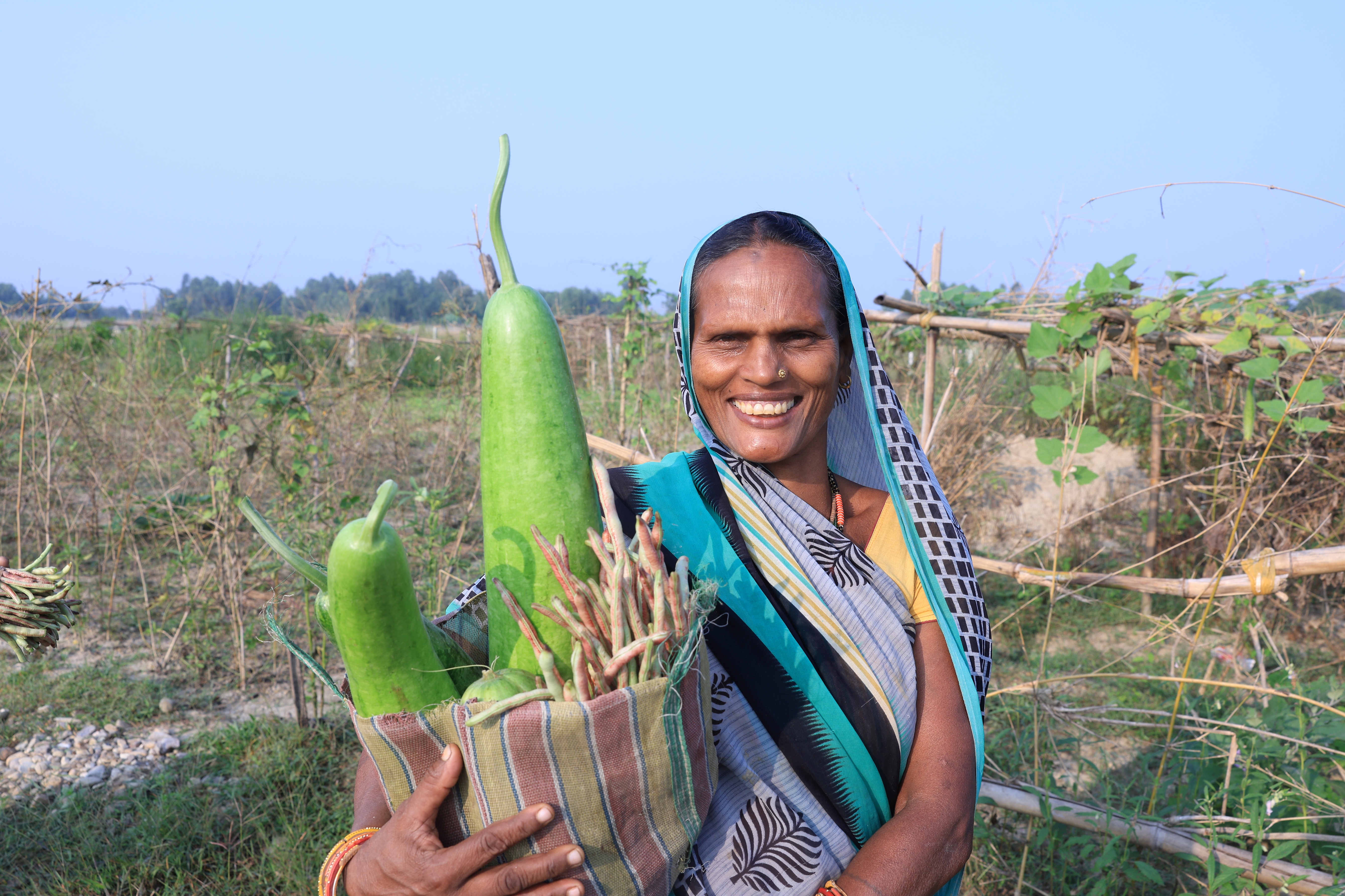 a woman standing in a farm