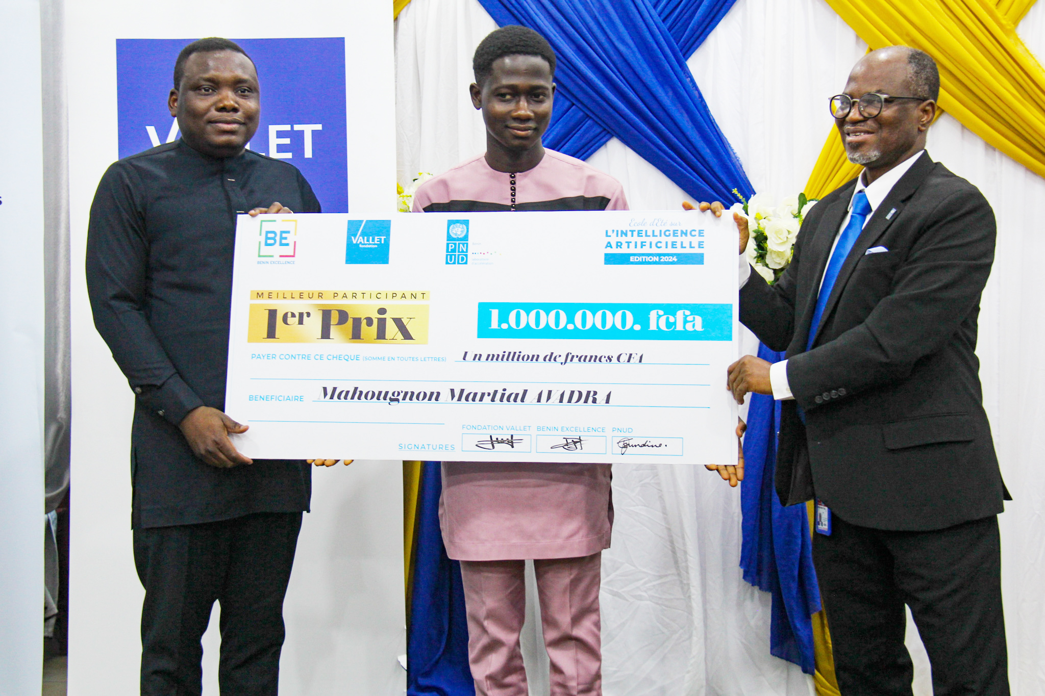 a group of people standing next to a person holding a sign