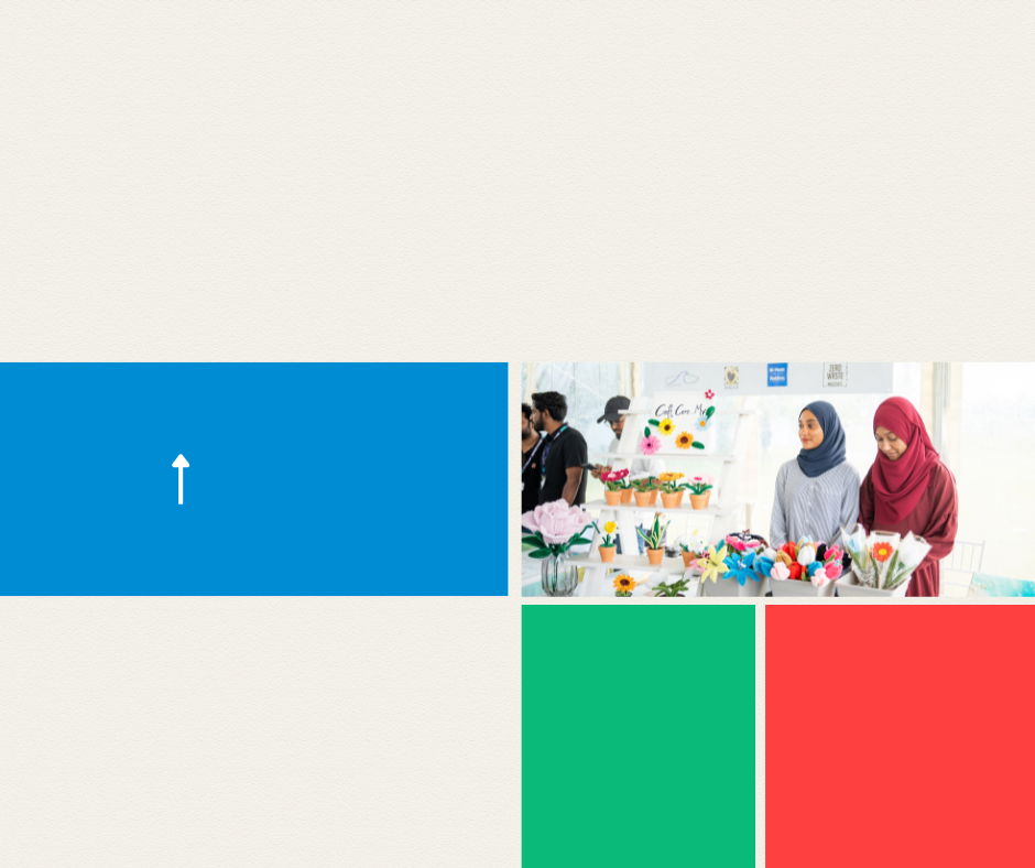 Two women in hijabs browsing a colorful display of decorative items.
